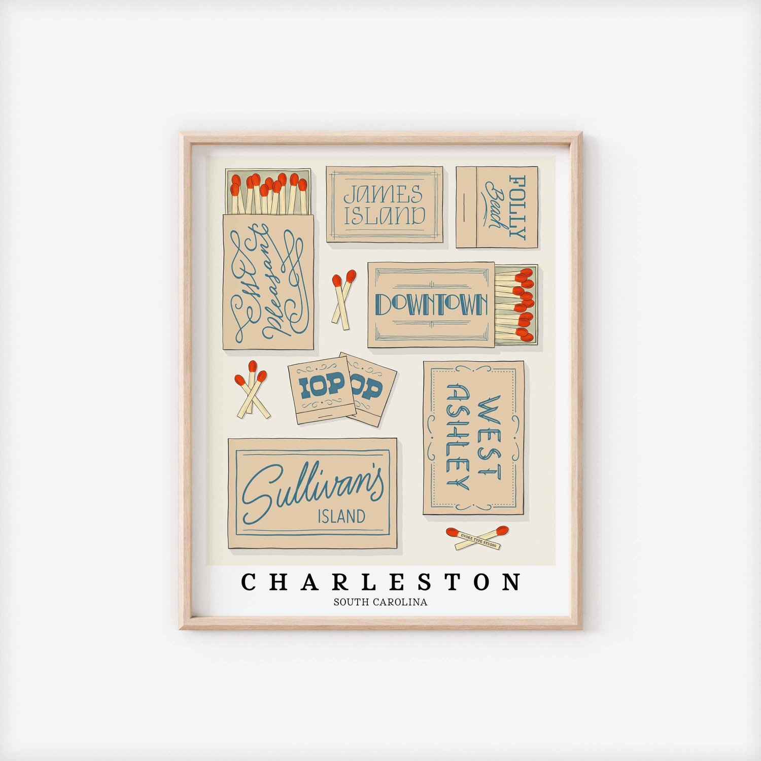 A framed picture of Charleston, South Carolina neighborhoods drawn in various lettering styles on matchboxes. Artwork has a beige and blue color scheme.