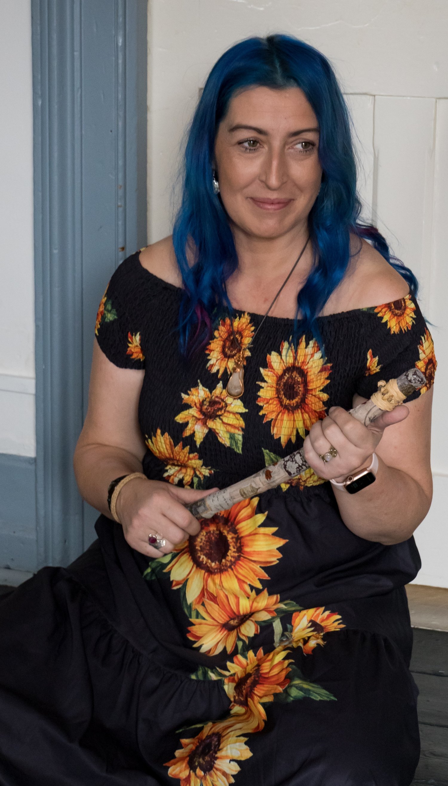 woman, stick, blue hair, sunflowers, guru circles