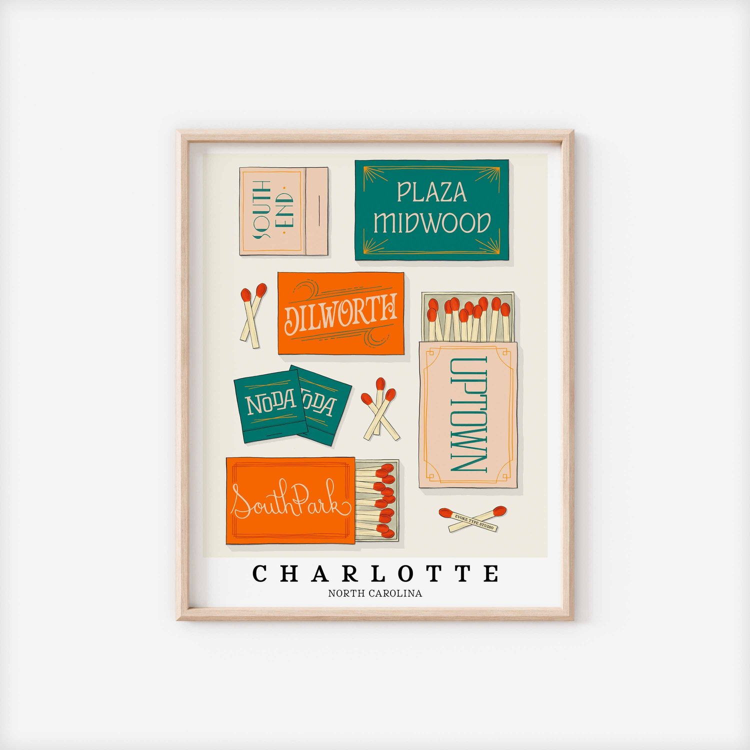 A framed picture of Charlotte, North Carolina neighborhoods drawn in various lettering styles on matchboxes. Artwork has a blue, orange and beige color scheme.