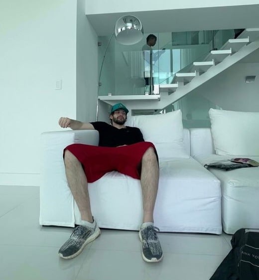 Rap producer JMcDouble relaxing while on set of a video shoot for his artist OneK