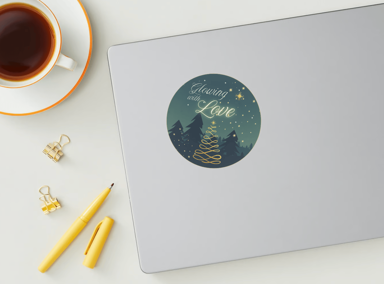 Customizable Golden Christmas Glow Circle Sticker | Digital Canva Template. Mock sticker on laptop