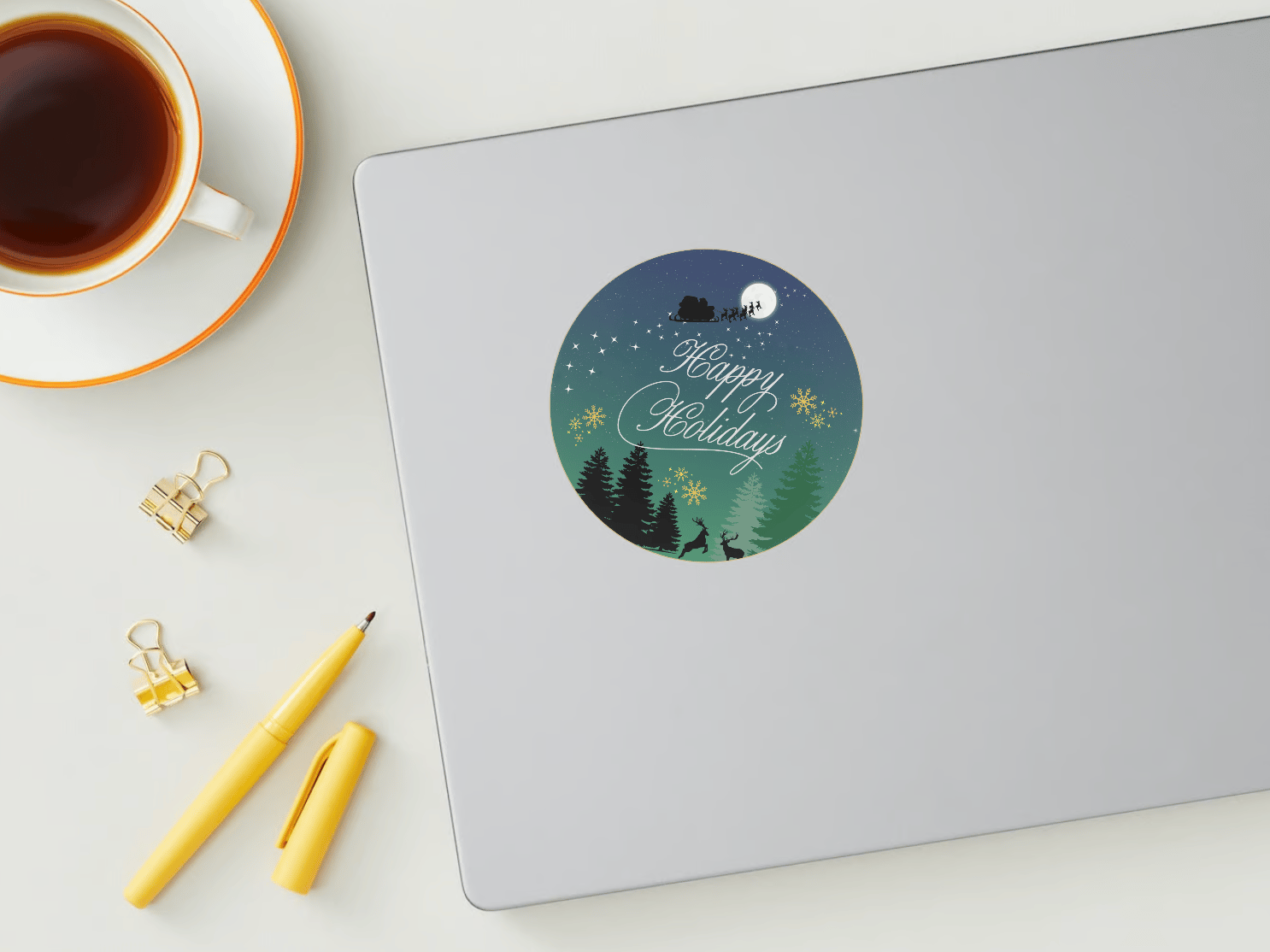 Customizable Aurora Night Santa Sleigh Circle Sticker | Digital Canva Template. Mock circle sticker on laptop