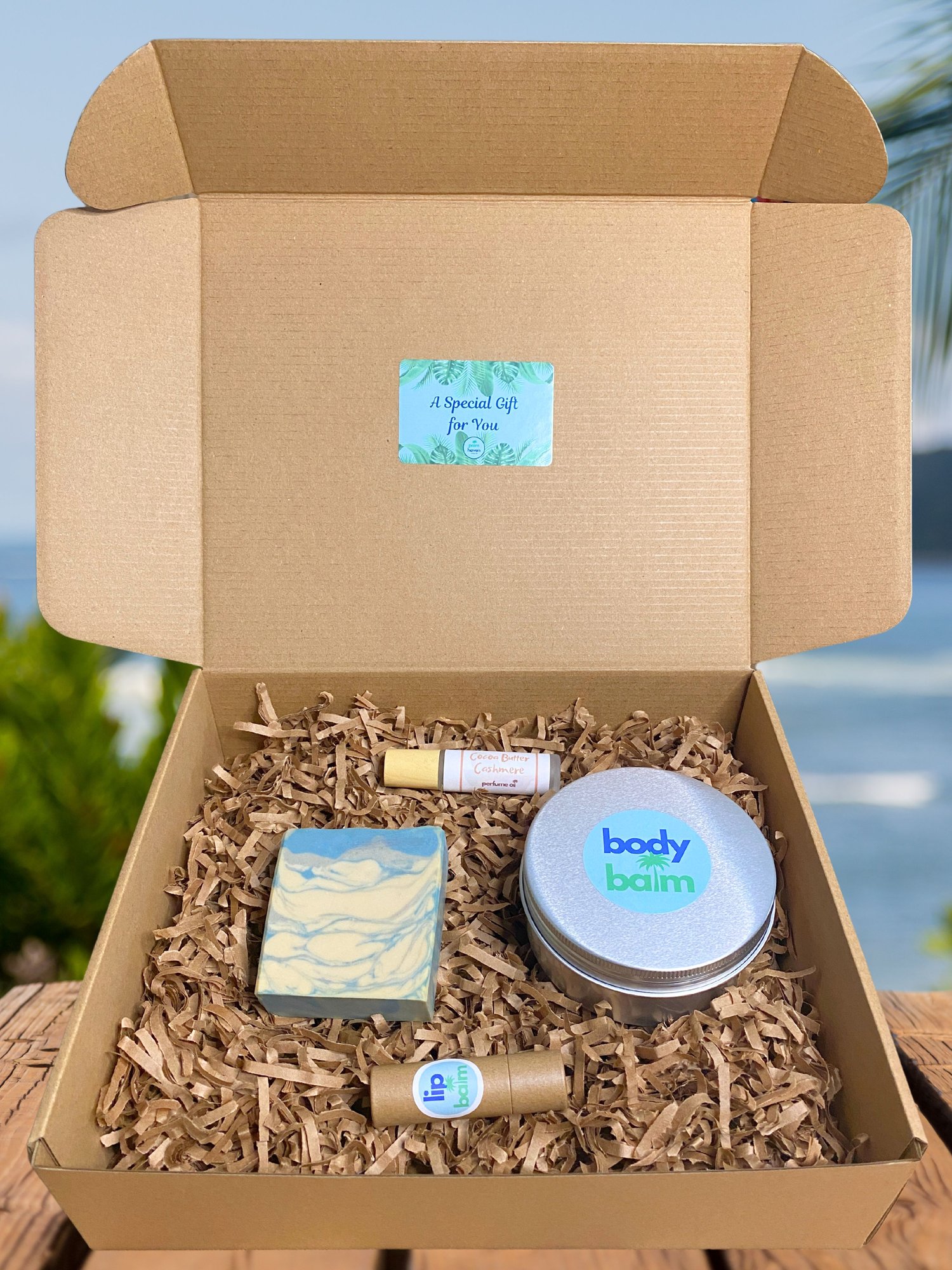 Ultimate gift box featuring handmade soap, body balm, perfume roller, and lip balm
