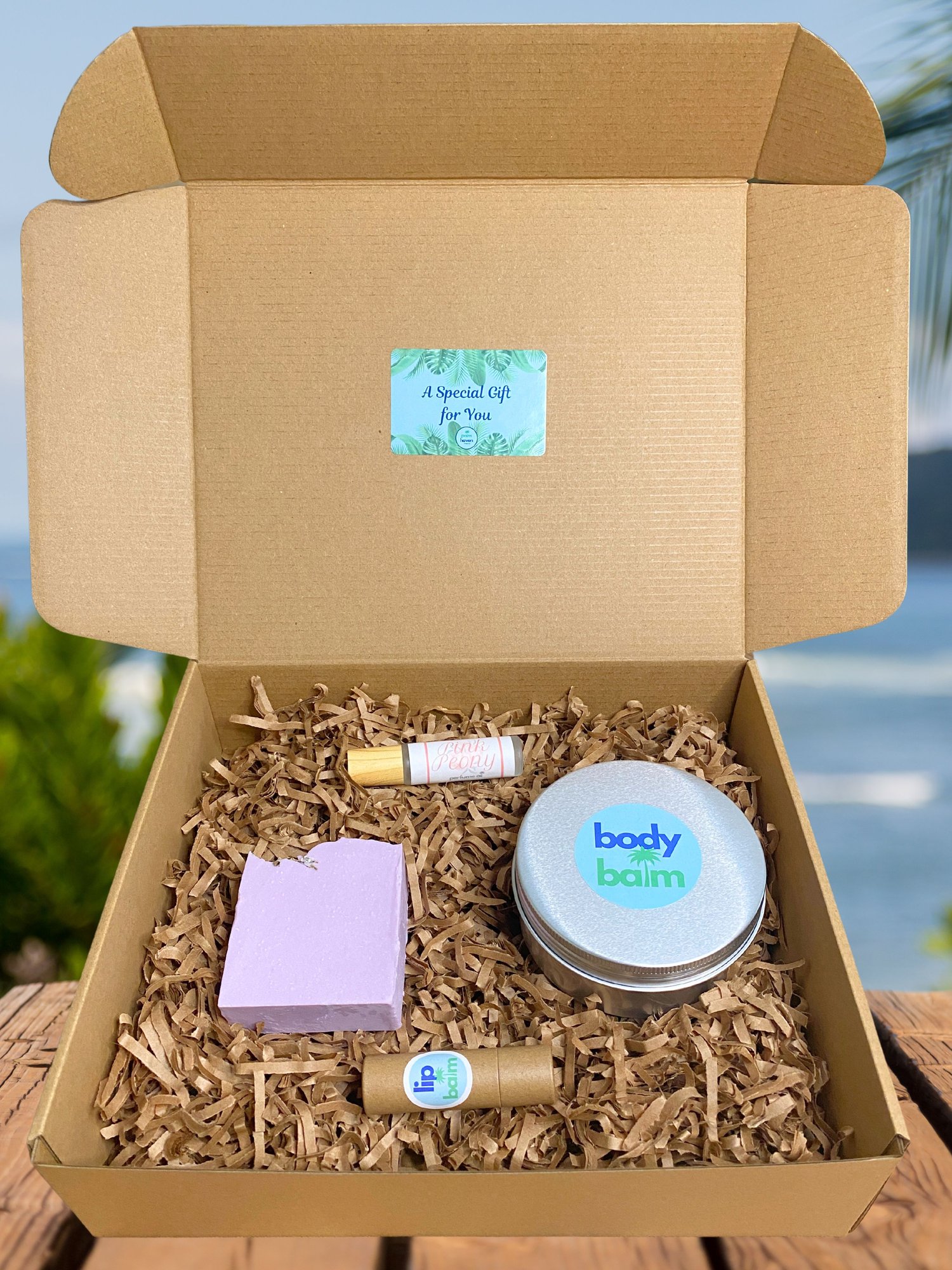 Ultimate gift box featuring handmade soap, body balm, perfume roller, and lip balm