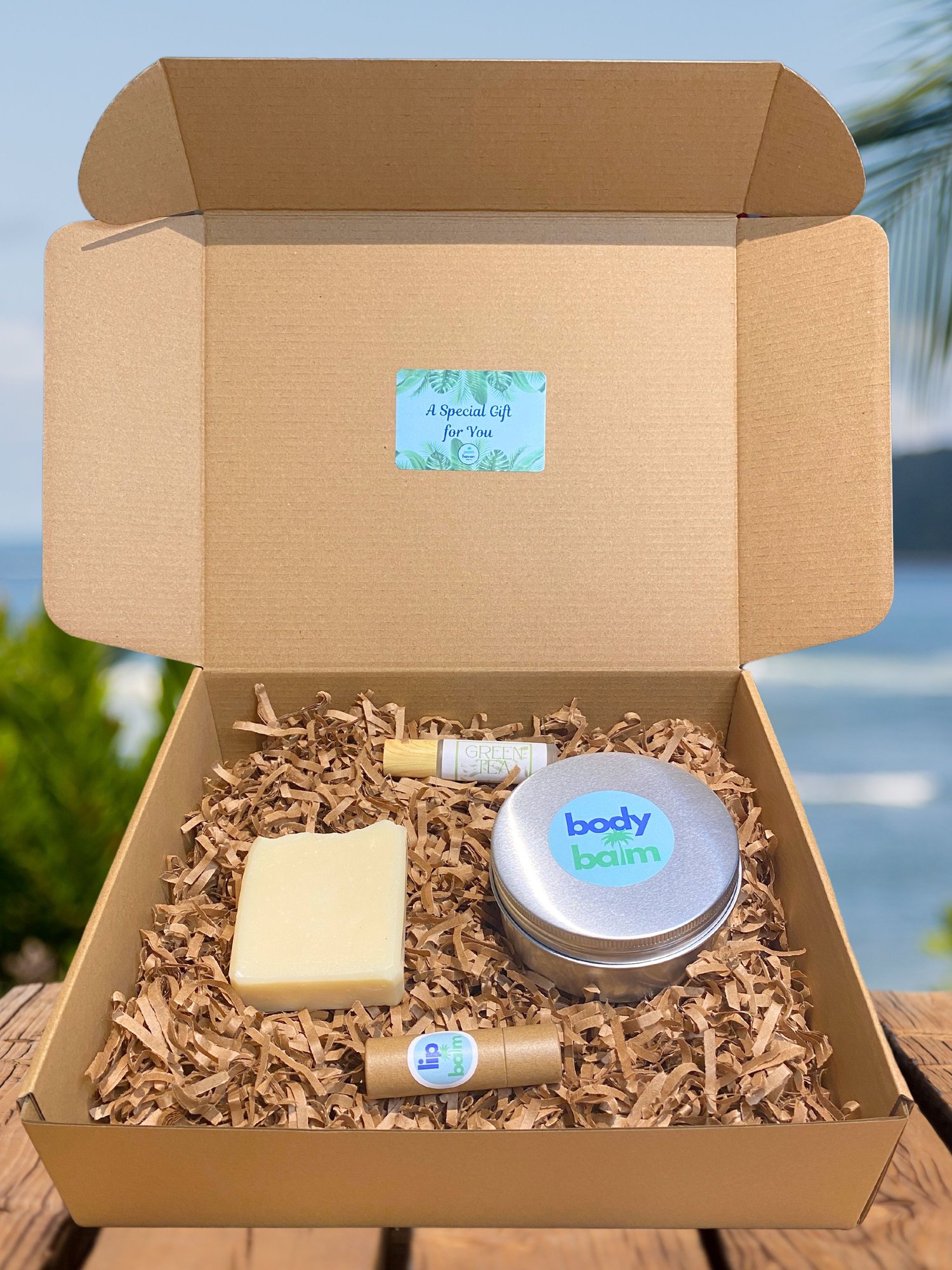 Ultimate gift box featuring handmade soap, body balm, perfume roller, and lip balm