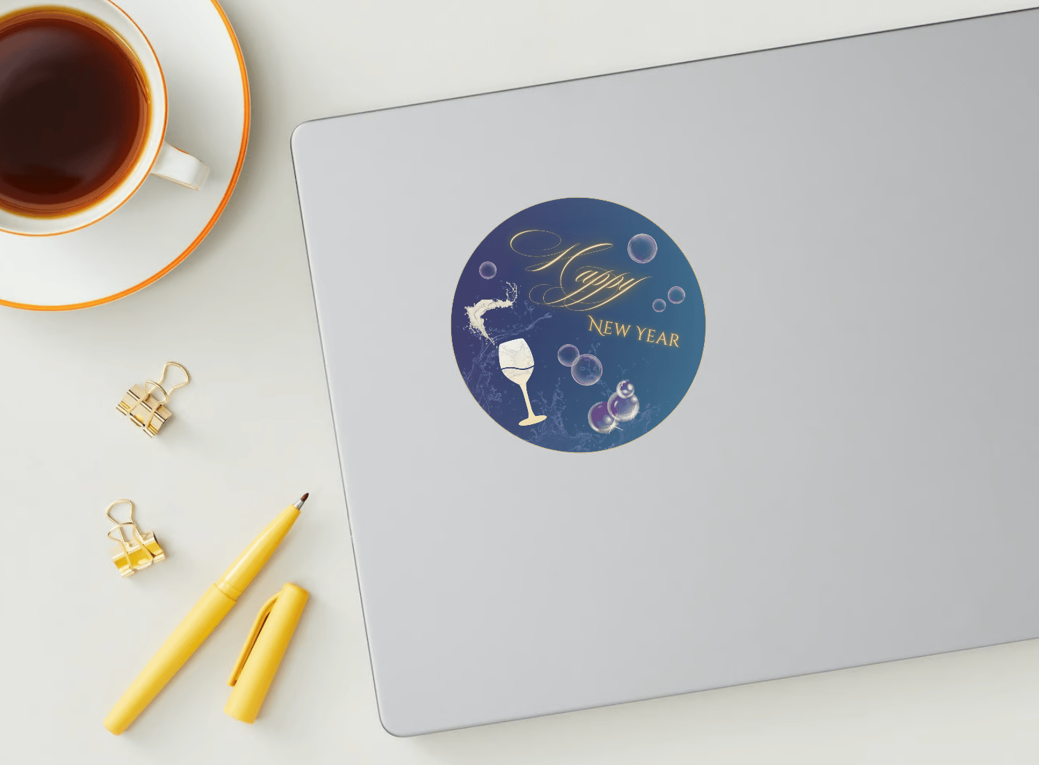 Customizable Elegant New Year Toast Circle Sticker | Digital Canva Template. Mock sticker on laptop