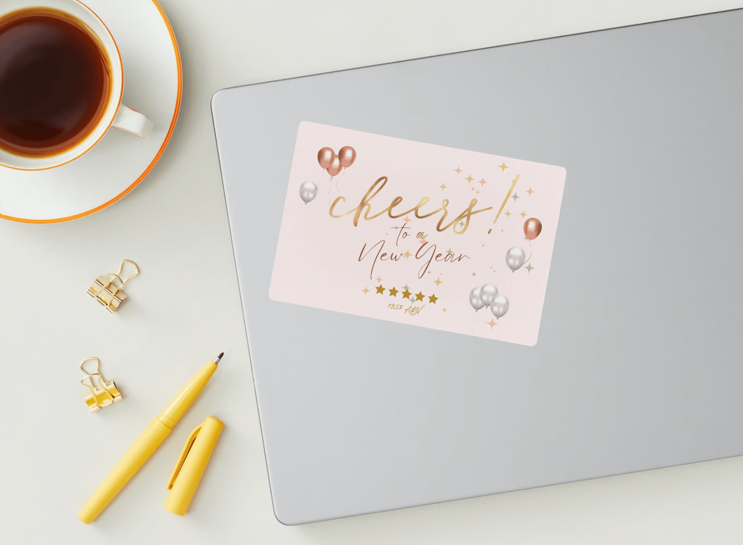 Customizable Cheers to New Year Celebration Sticker Label 6"x4" | Digital Canva Template. Mock sticker on laptop