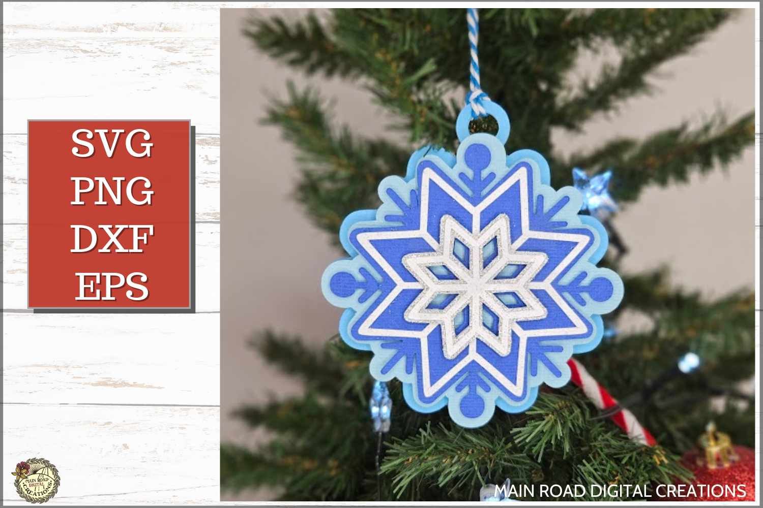 Layered snowflake ornament SVG design in blue and white, hanging on a Christmas tree—made with Cricut using cardstock for holiday decor