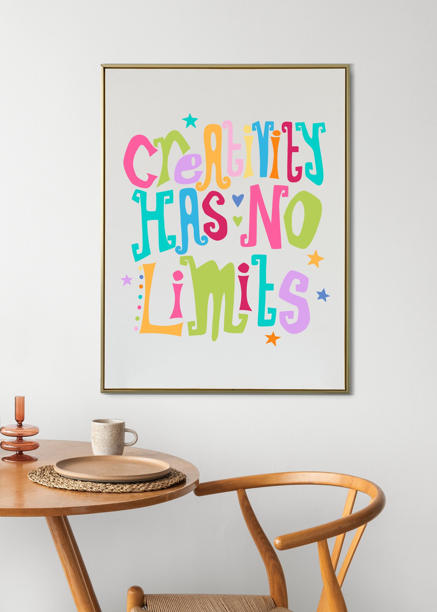 A downloadable print with a hand lettered design which says ‘creativity has no limits’ in a range of bright colours.