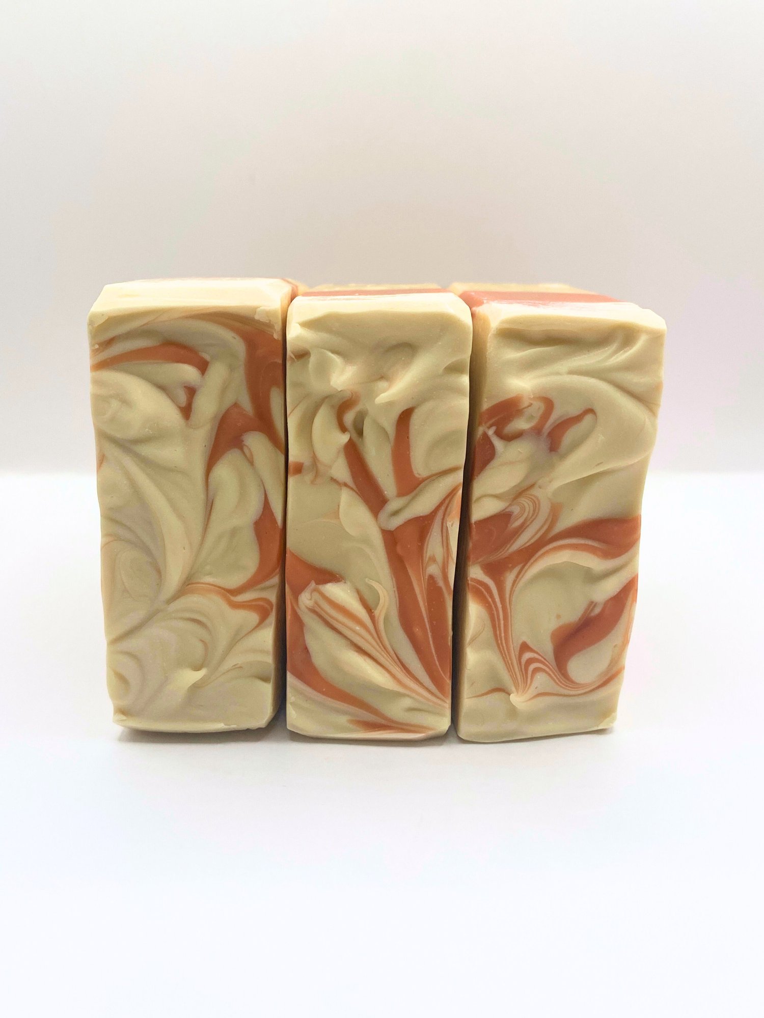 Handmade oat milk soap bars swirled with pink French clay