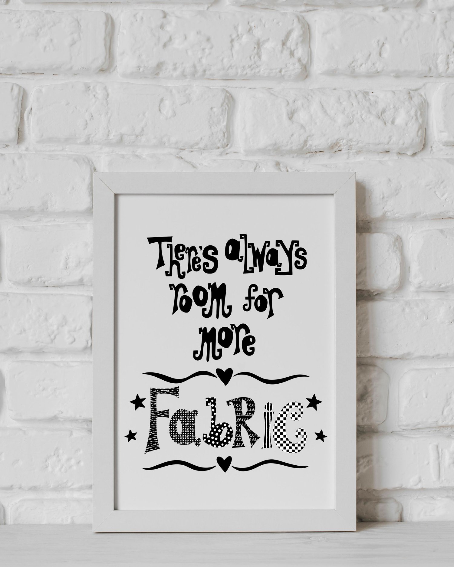 A downloadable print with a hand lettered design which says ‘there’s always room for more fabric’ in black.