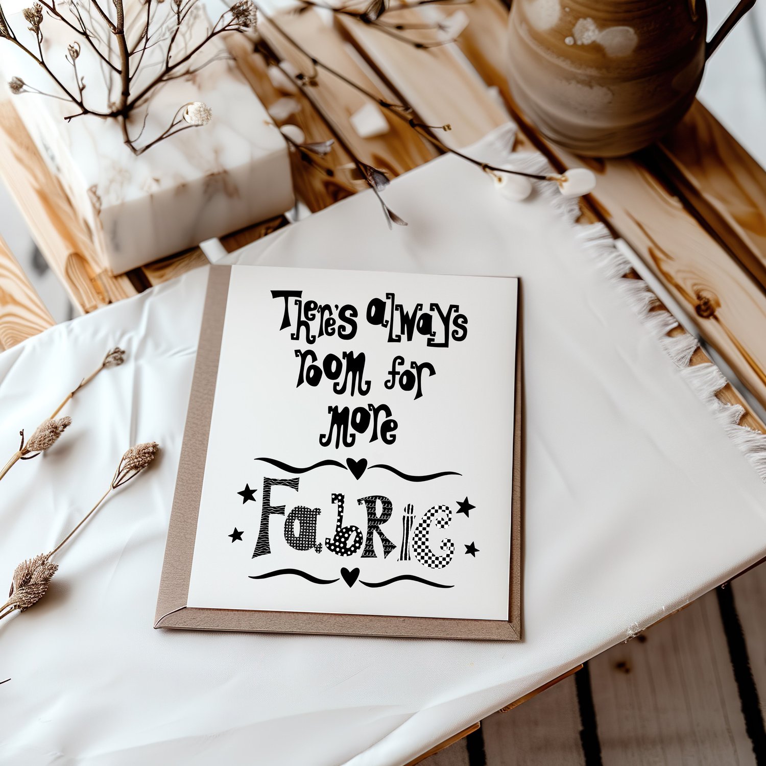 A downloadable print with a hand lettered design which says ‘there’s always room for more fabric’ in black.
