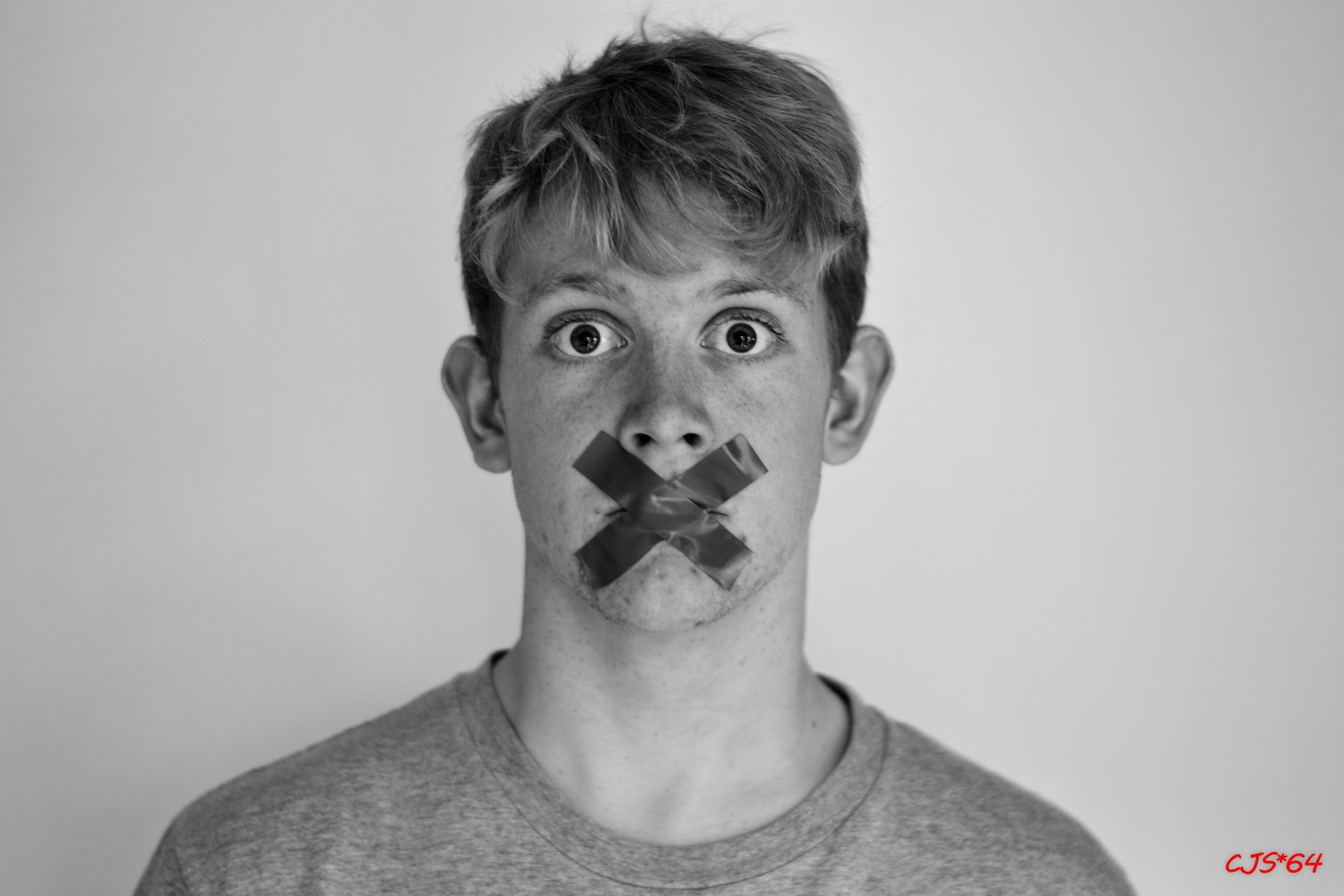 man with tape on his mouth