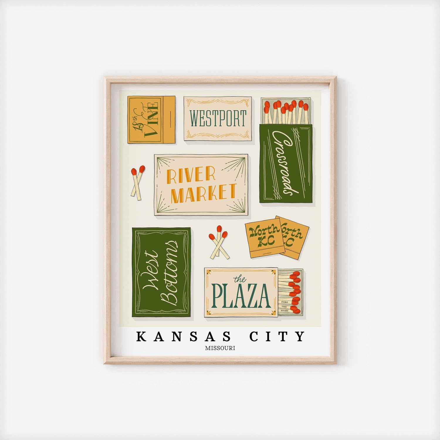 A framed picture of Kansas City, Missouri neighborhoods drawn in various lettering styles on matchboxes. Artwork has a green, yellow, white and blue color scheme