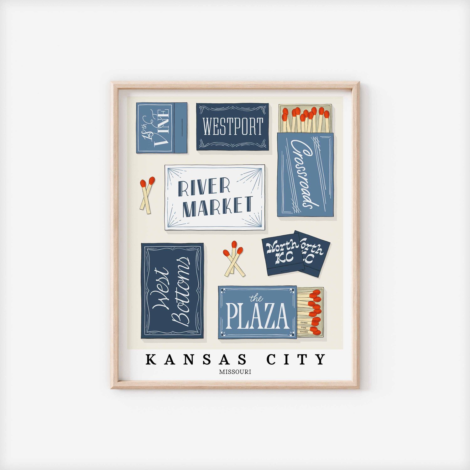 A framed picture of Kansas City, Missouri neighborhoods drawn in various lettering styles on matchboxes. Artwork has a blue and white color scheme