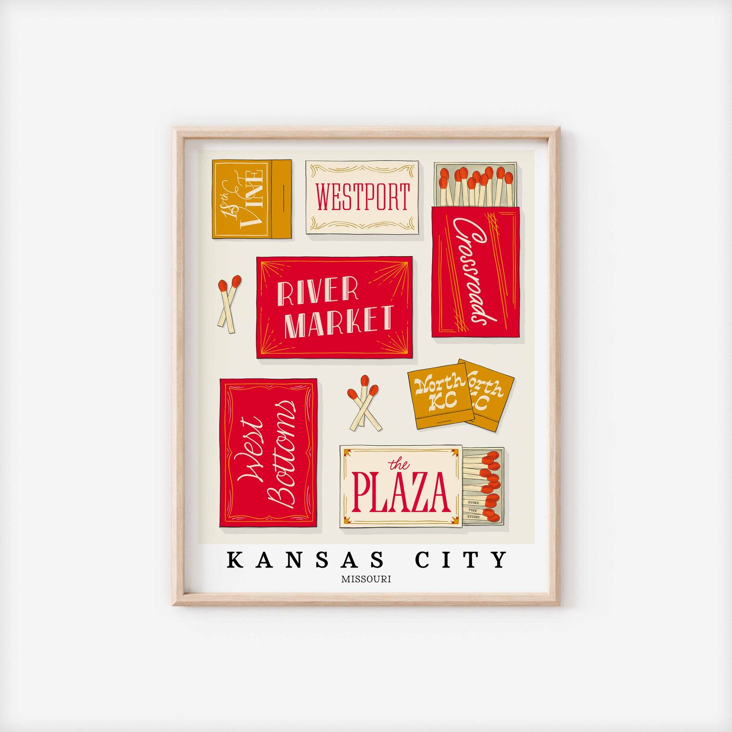 A framed picture of Kansas City, Missouri neighborhoods drawn in various lettering styles on matchboxes. Artwork has a red and gold color scheme