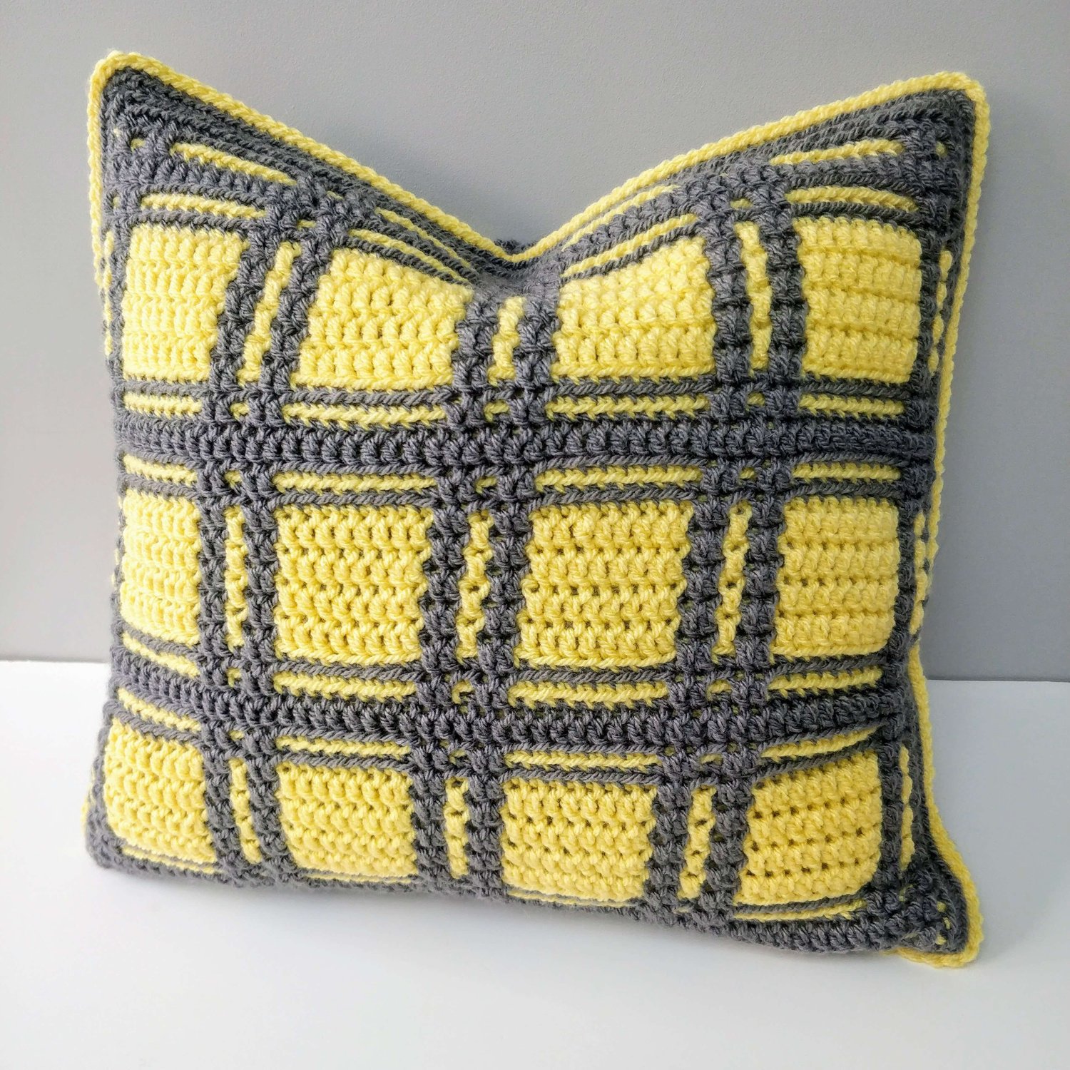 Lemon and grey plaid crochet cushion