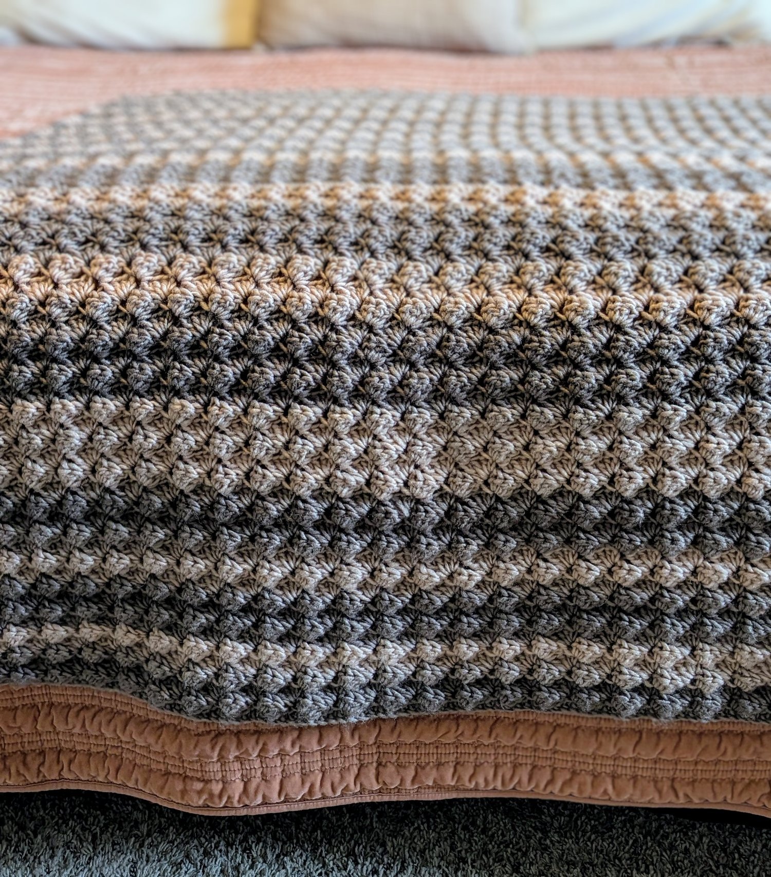 Woodland Crochet Blanket Pattern on bed