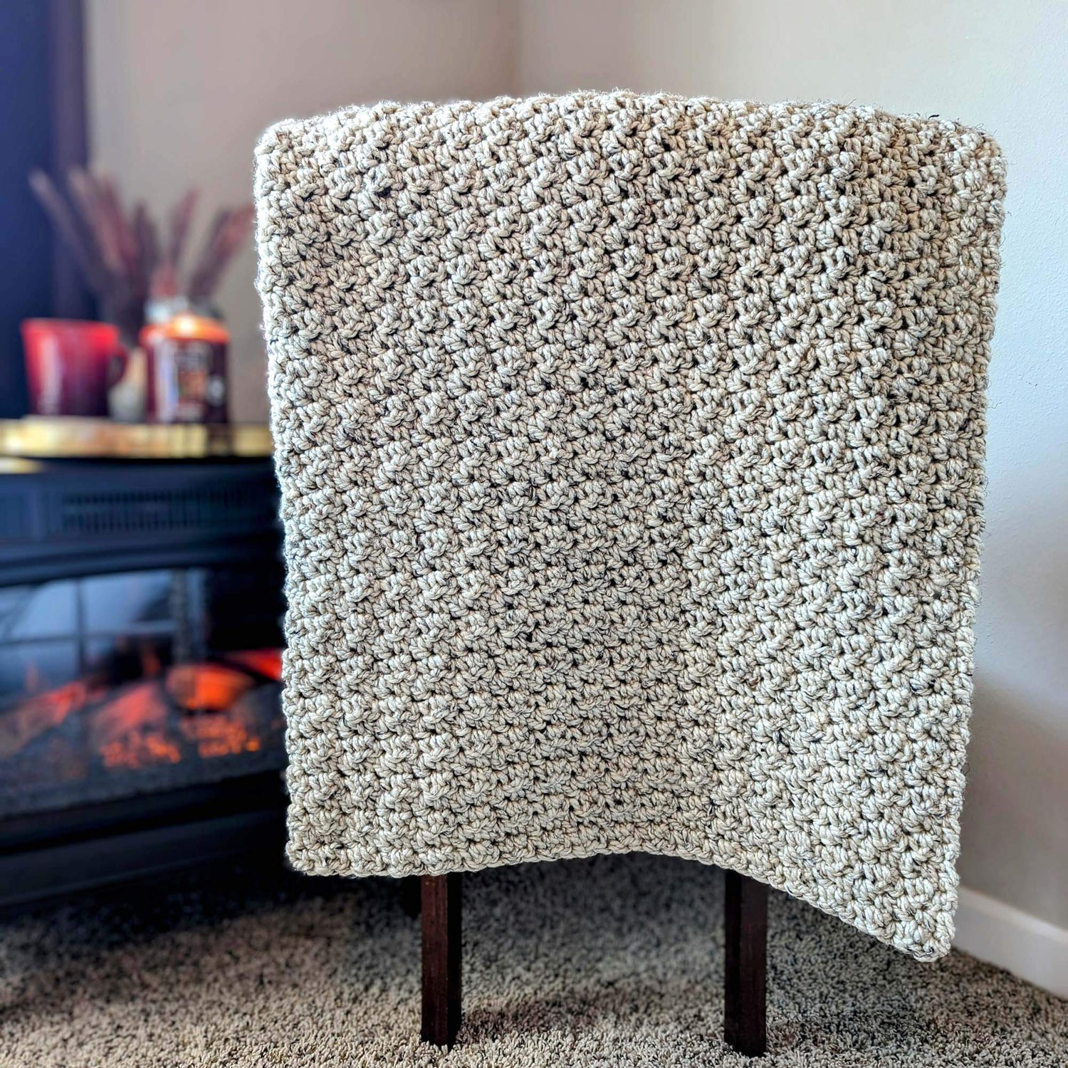 Fireside Throw Crochet Blanket Pattern on chair