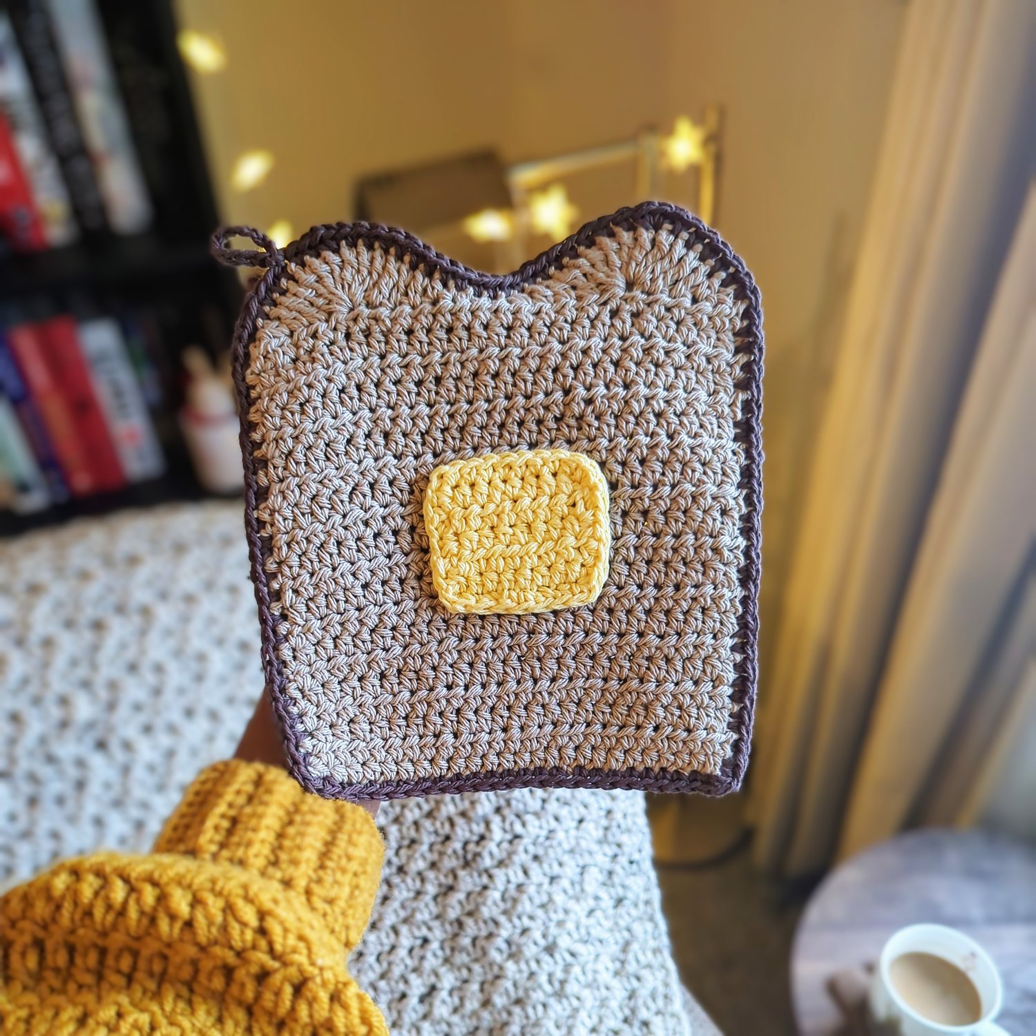 Buttered Toast Potholder Crochet Pattern holding in hand