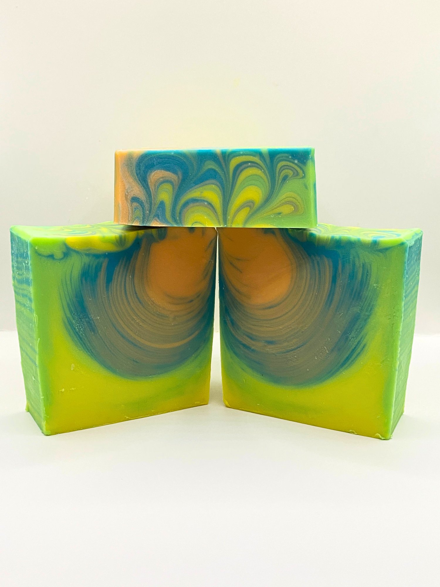 Surfing the Tube handmade soap depicts an artistic wave swirl