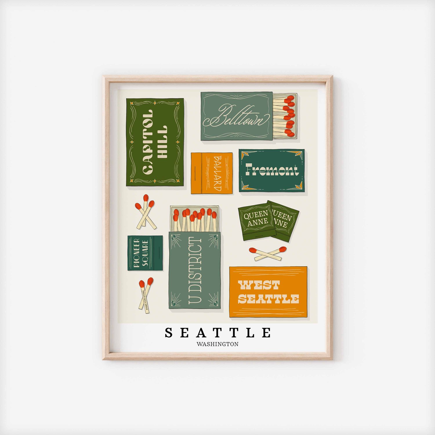 A framed picture of Seattle, Washington neighborhoods drawn in various lettering styles on matchboxes. Artwork has a green, yellow and blue color scheme