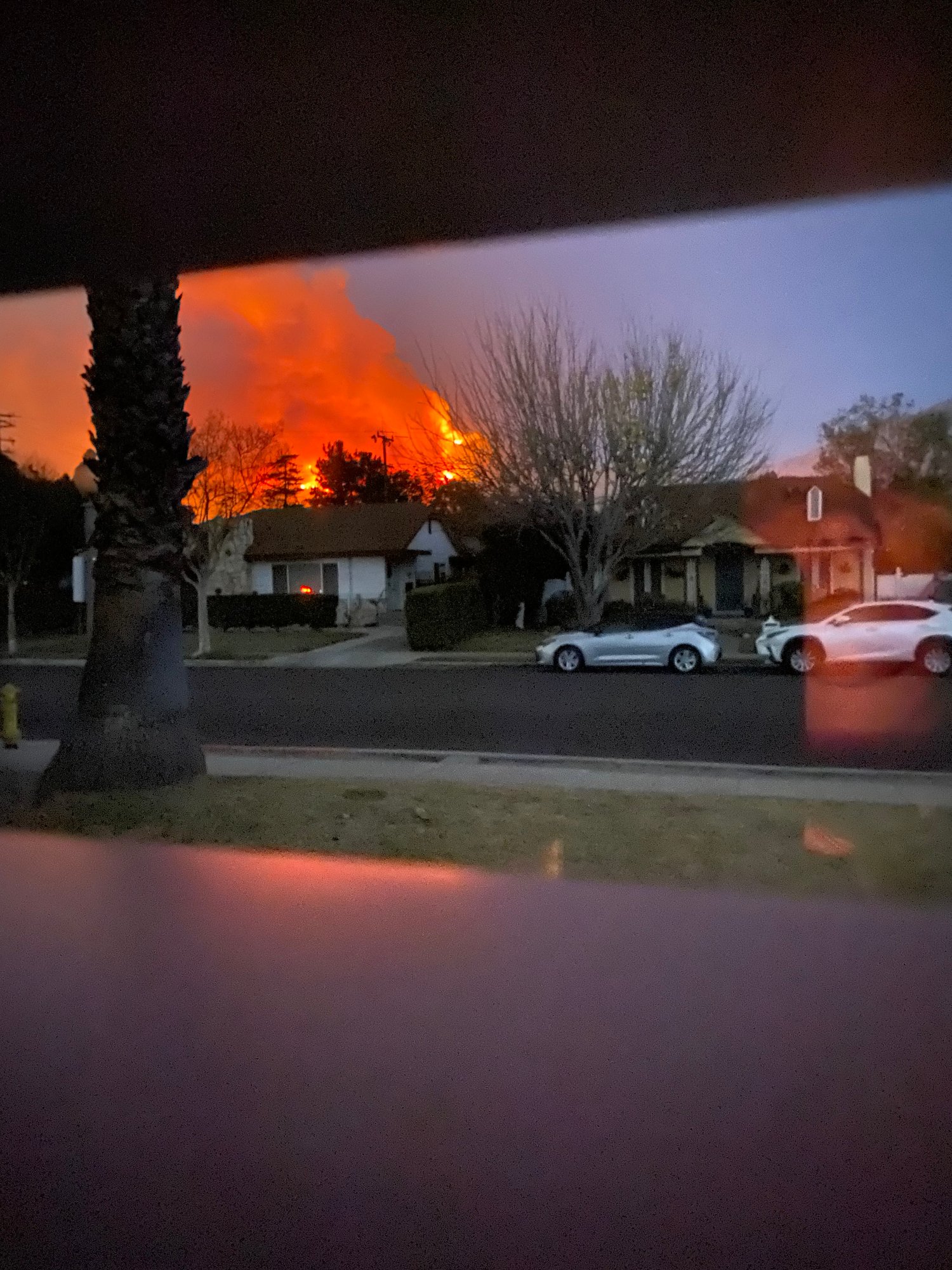The photo shows the fire in the San Gabriel Mountains behind Stacey Inal's home in January 2025.