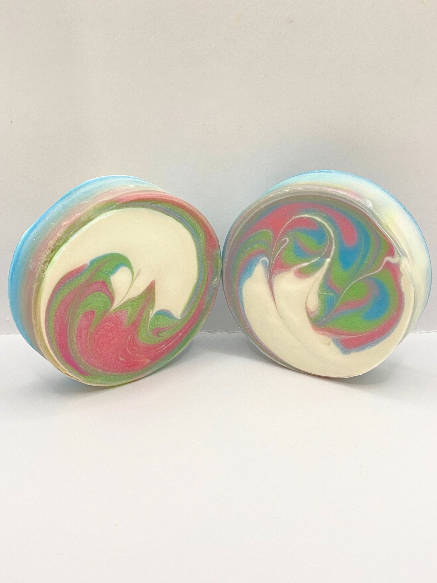 Handmade White Tea and Sage Swirled Soap, round soap swirled with pink, blue, green, and white