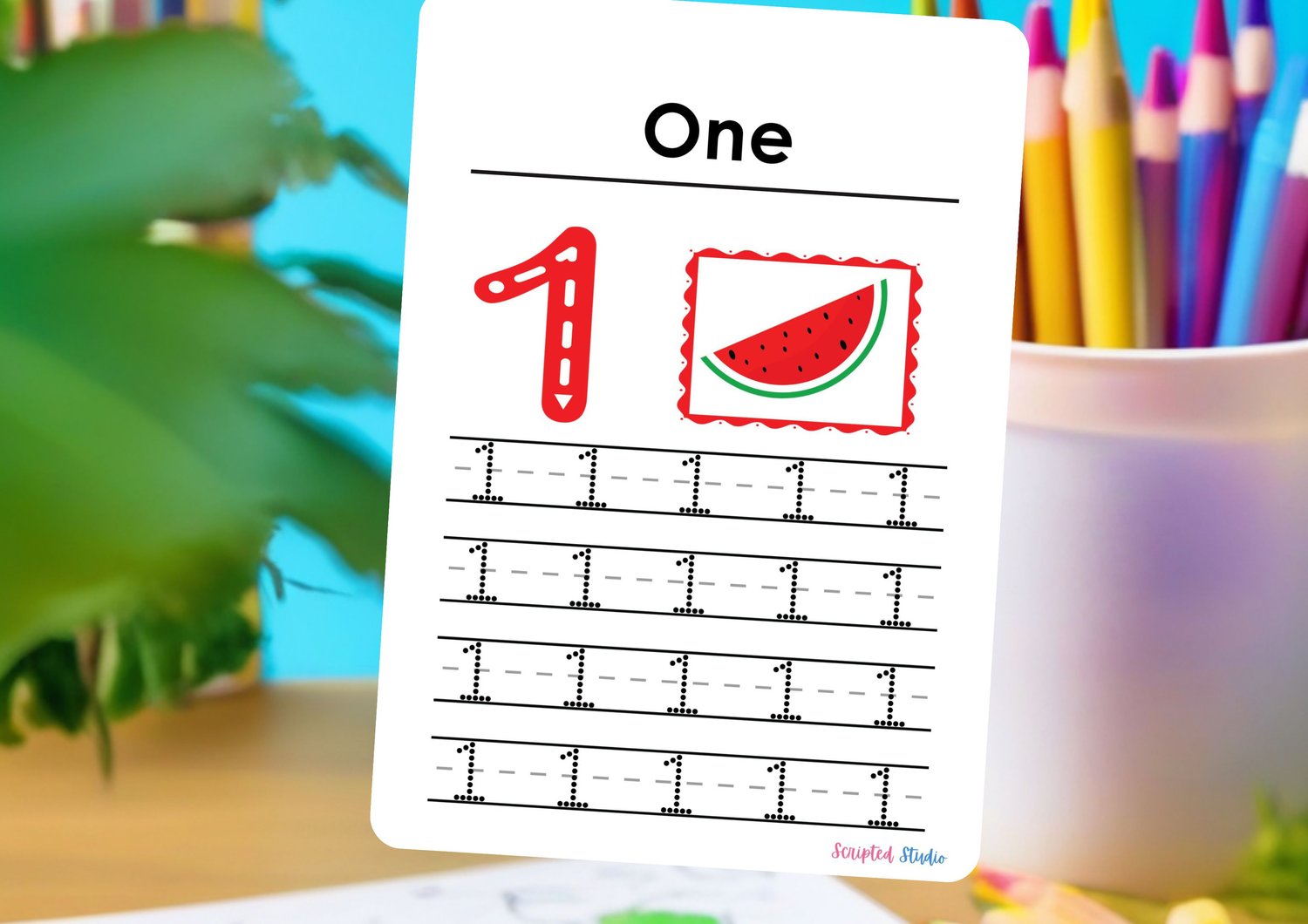 number-flashcards-1-4-handwriting-practice on a flashcard on a desk with pencils