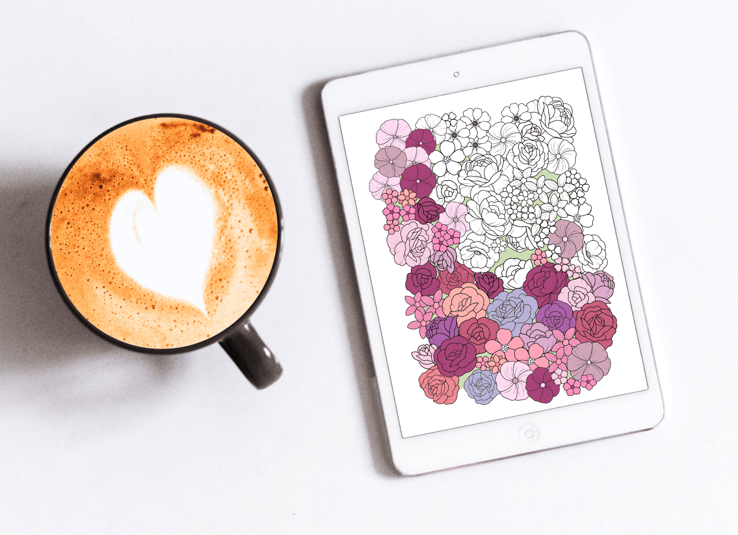 tablet with flower field habit tracker along side a cup of coffee