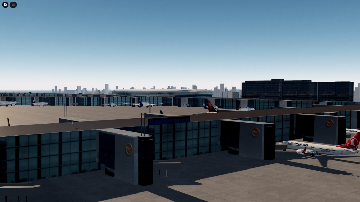 Close-up view of Frankfurt Airport jet bridges and passenger terminals in a realistic game map.
