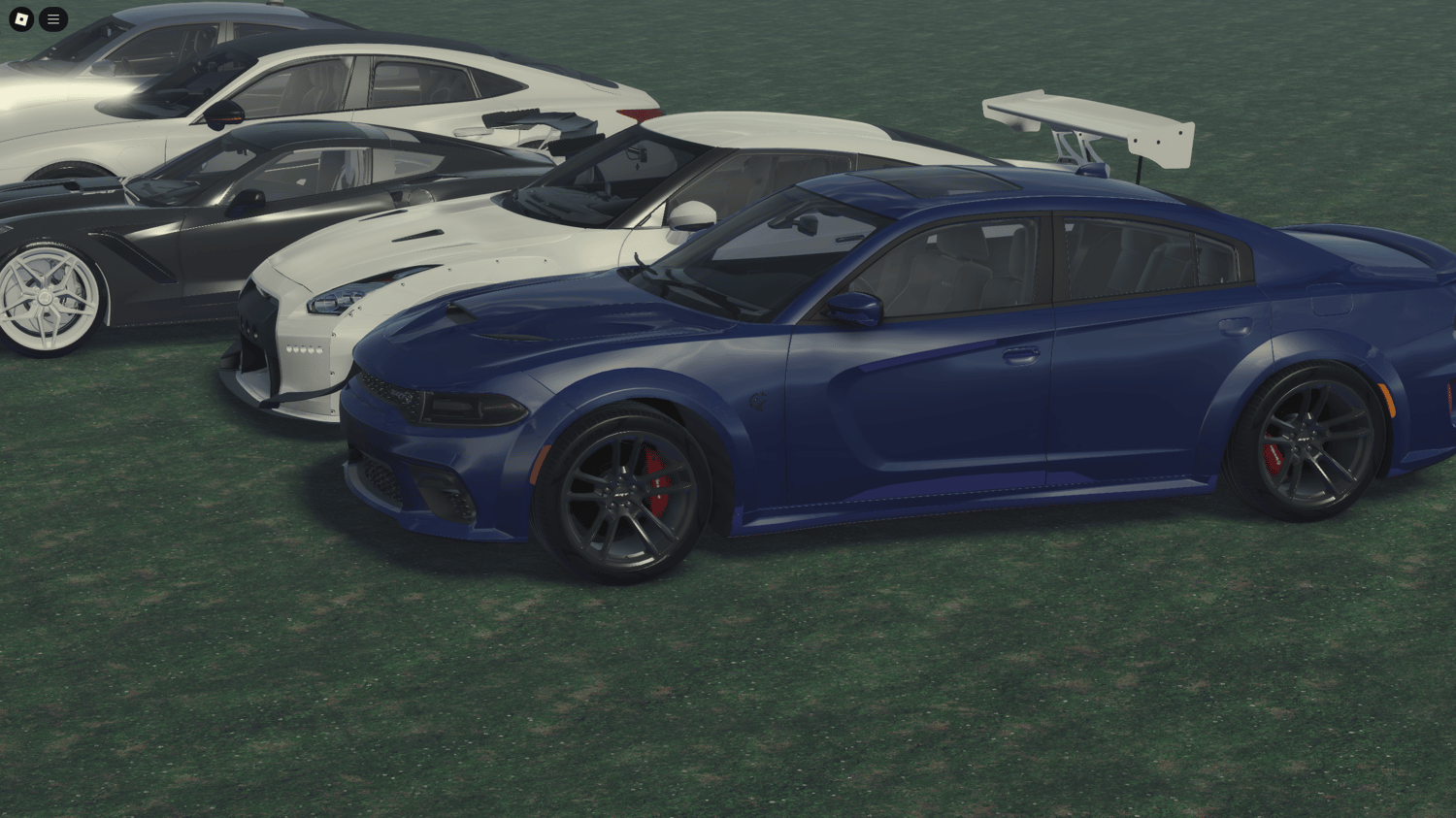 Rear angle displaying the custom spoilers and exhausts of the cars.