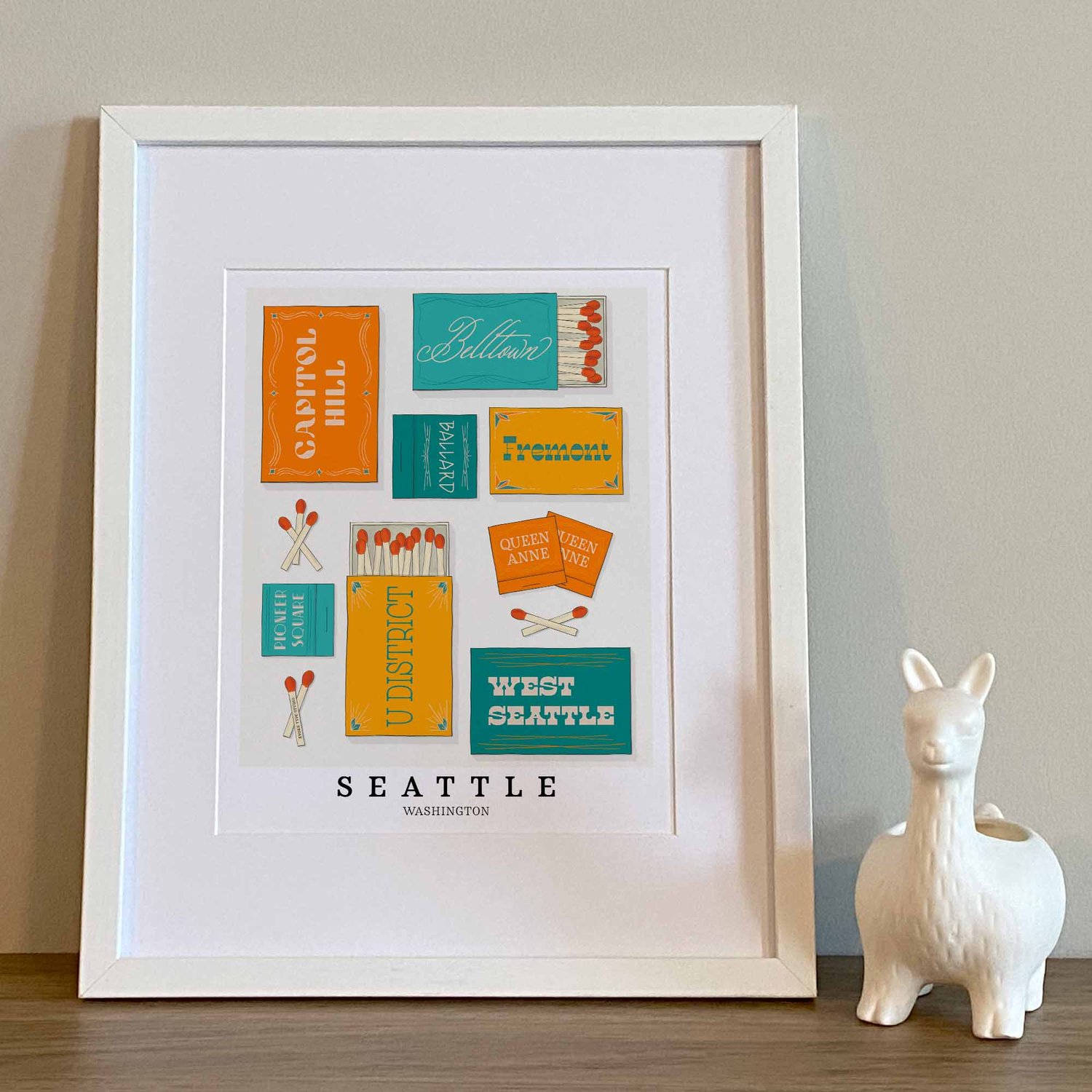 Seattle neighborhood matchbox art print with playful hand-lettered typography in the Retro Feels color palette