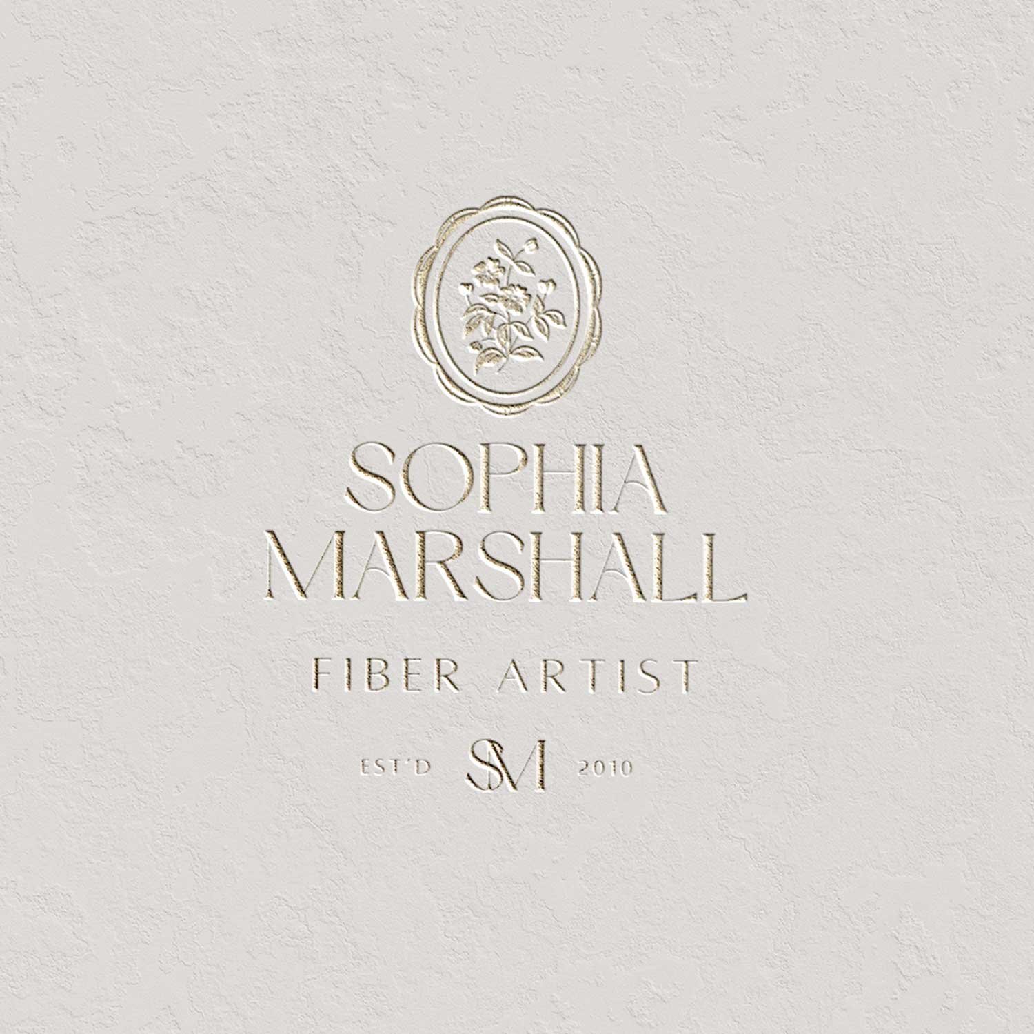 Logo design featuring hand drawn illustration of wildflowers in a scalloped frame that says Sophia Marshall Fiber Artist