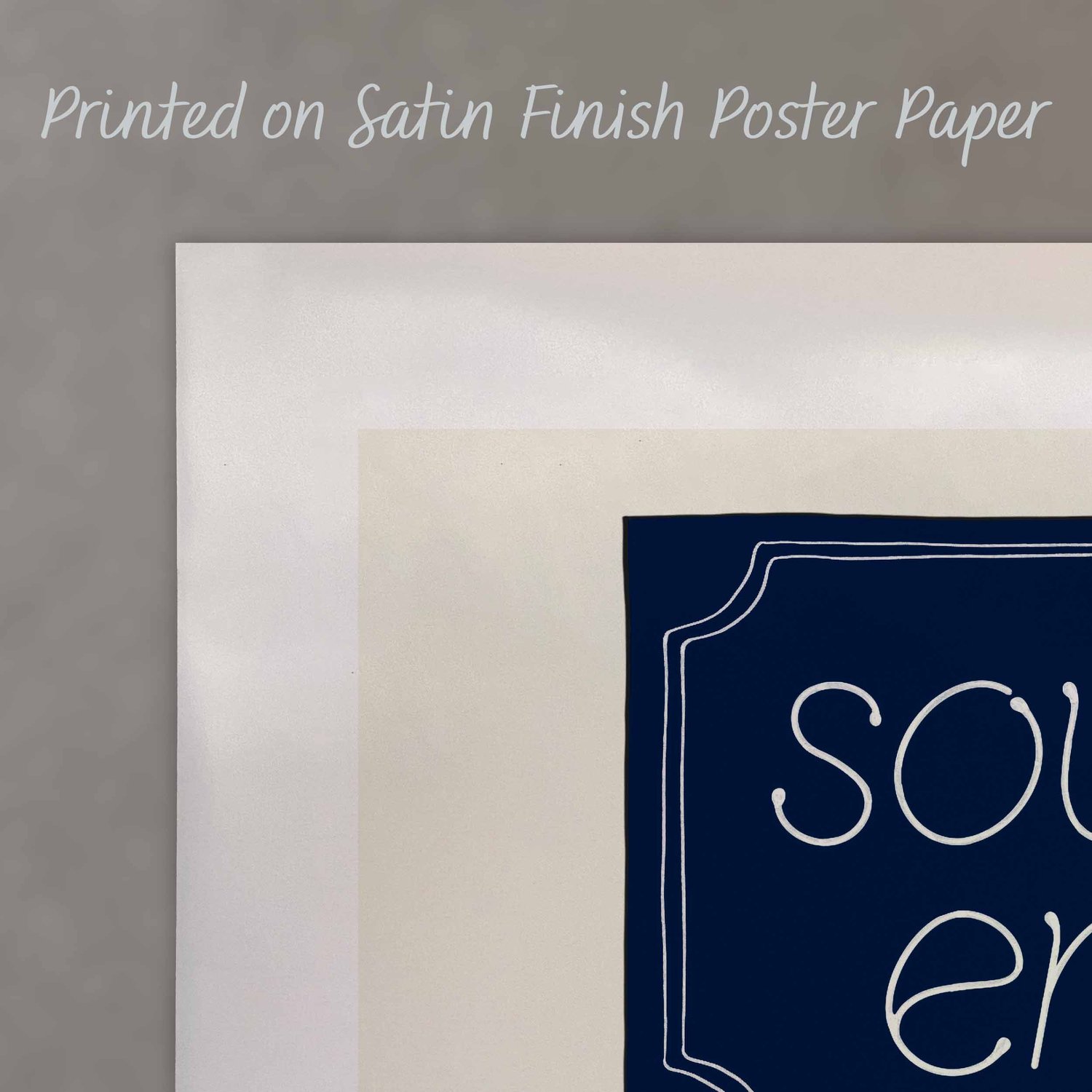 A close up of a poster with text saying “Printed on Satin Finish Poster Paper”