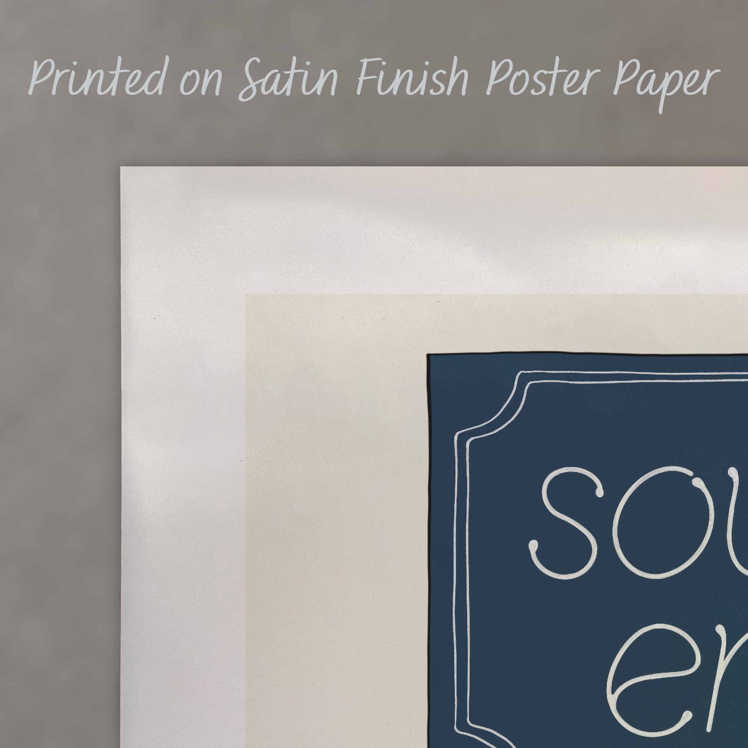 A close up of a poster with text saying “Printed on Satin Finish Poster Paper”