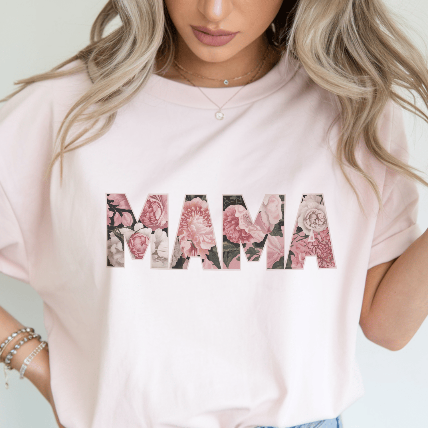 Pink floral cutout MAMA text design on a t-shirt — PNG design for Mother’s Day sublimation, Cricut crafts, and printable projects.