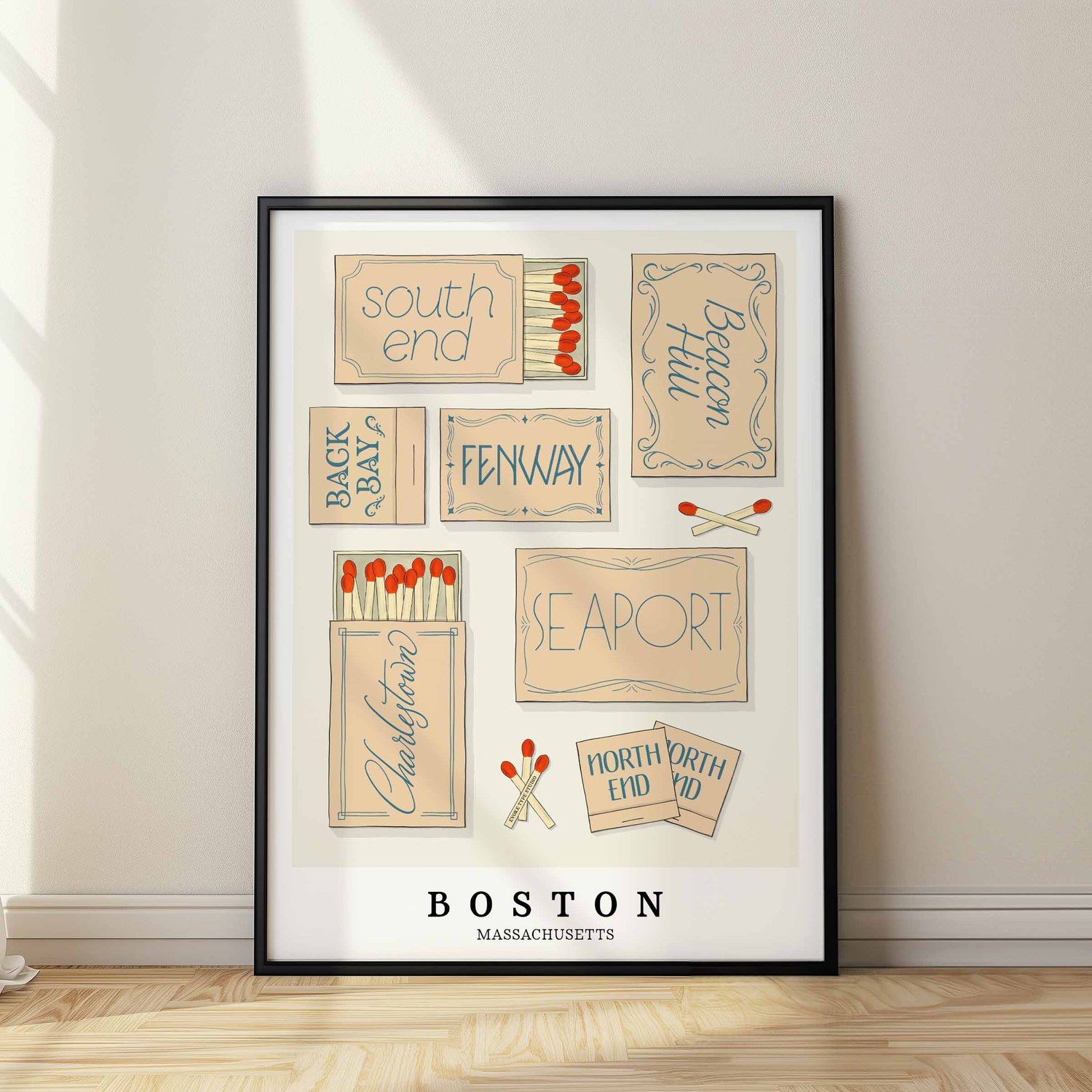 A framed picture of Boston, Massachusetts neighborhoods drawn in various lettering styles on matchboxes. Artwork has a beige and blue color scheme