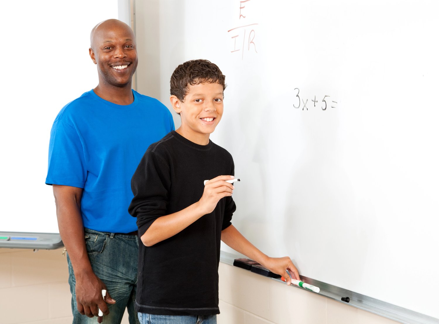 Middle school student solving linear equation with teacher support