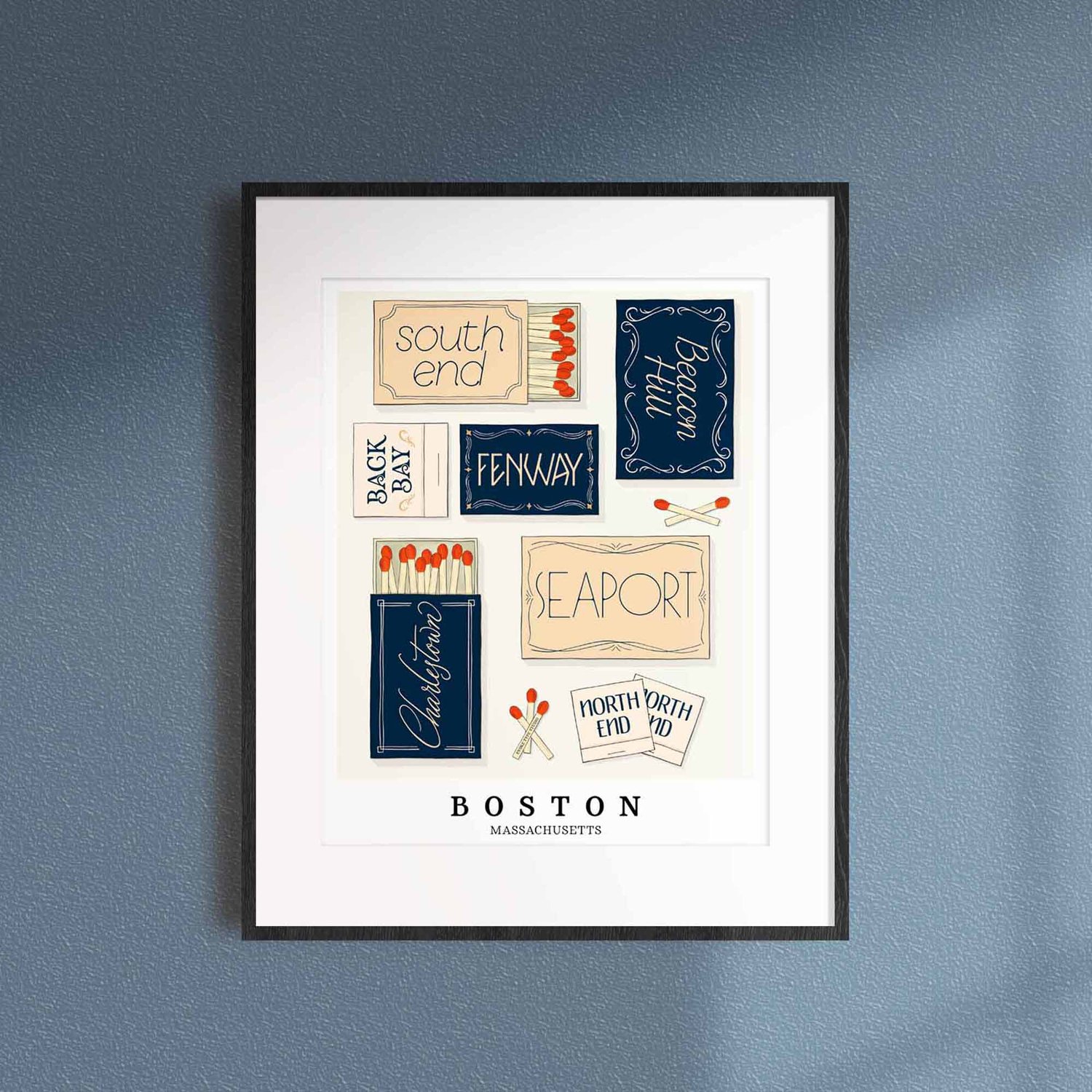 A framed picture of Boston, Massachusetts neighborhoods drawn in various lettering styles on matchboxes. Artwork has a nautical color scheme of blue, beige and light brown.