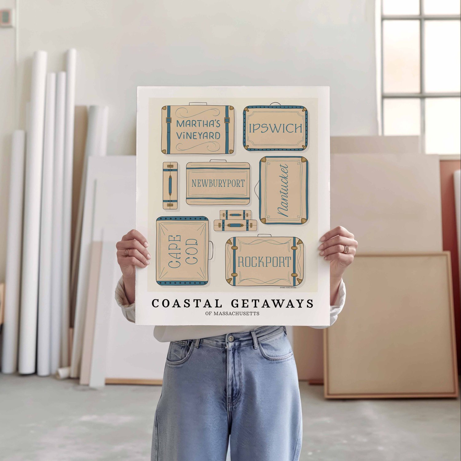 A person holding a poster of several suitcases