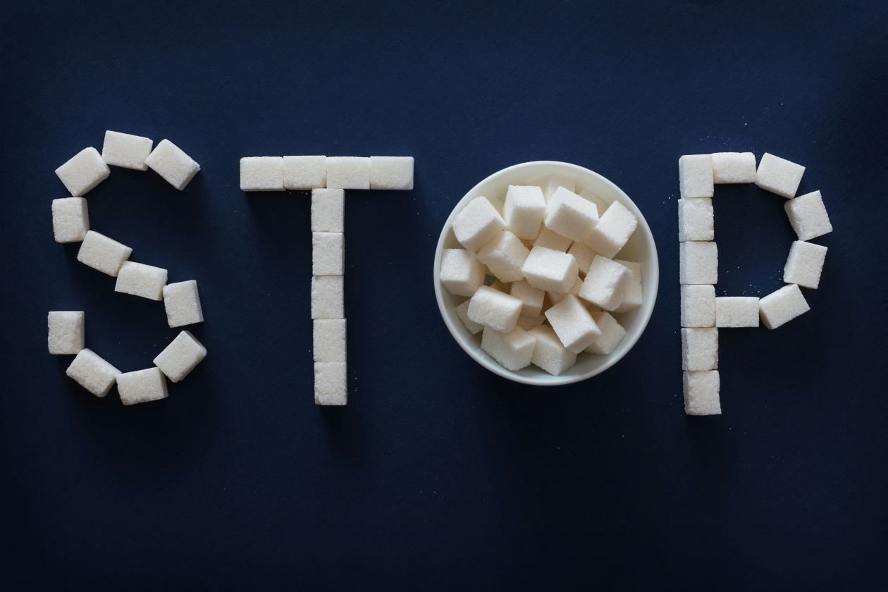 The word STOP spelled in cubes of cheese.