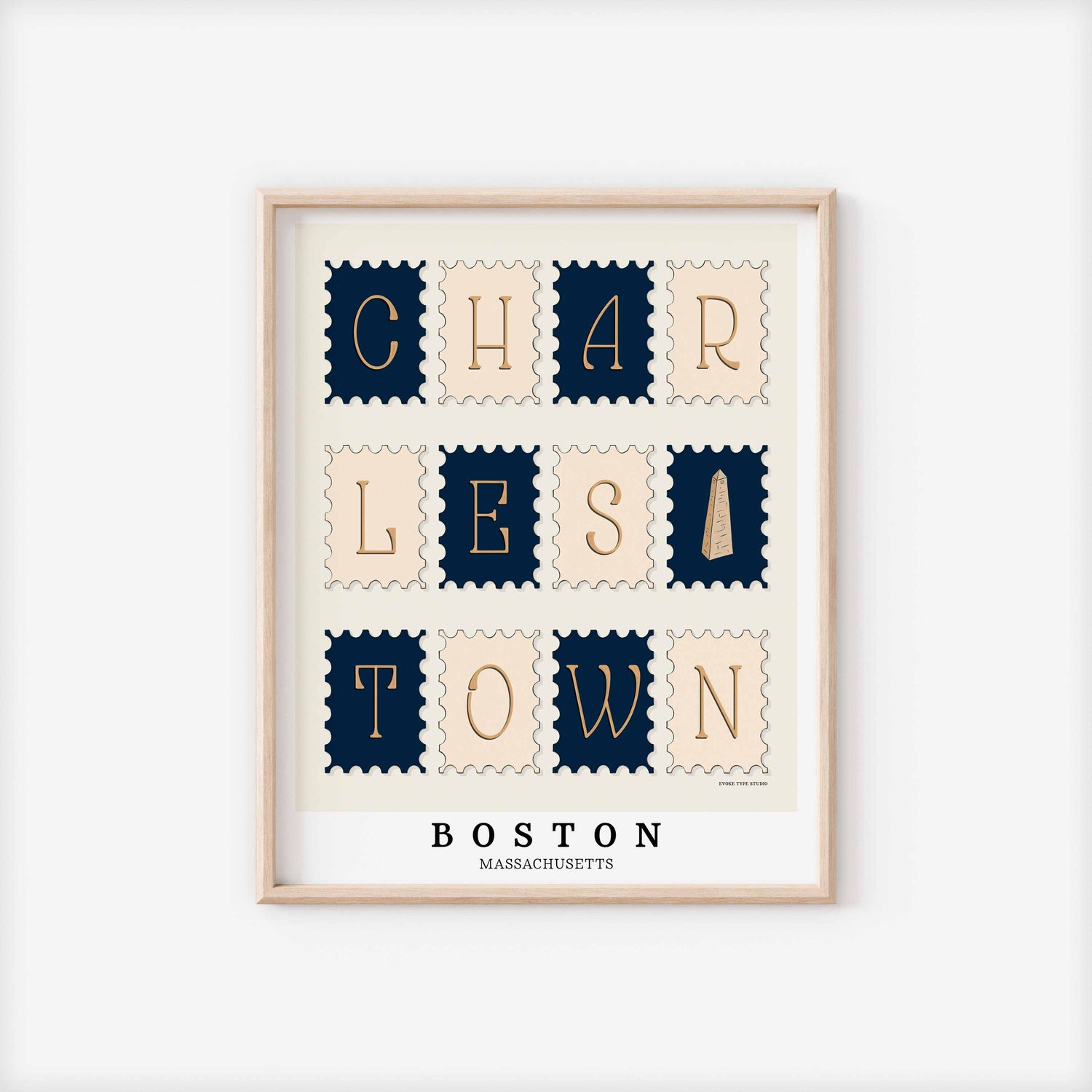 A framed picture of postage stamps featuring the Charlestown neighborhood in Boston, Massachusetts drawn in a unique lettering style. Artwork has a nautical color scheme of navy blue and beige