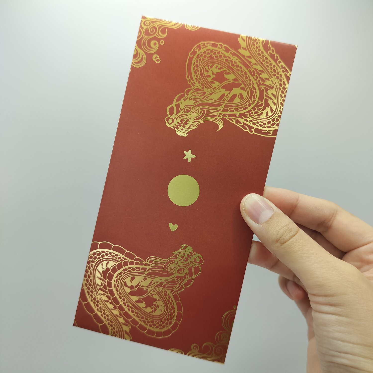 A red envelope with gold dragon design