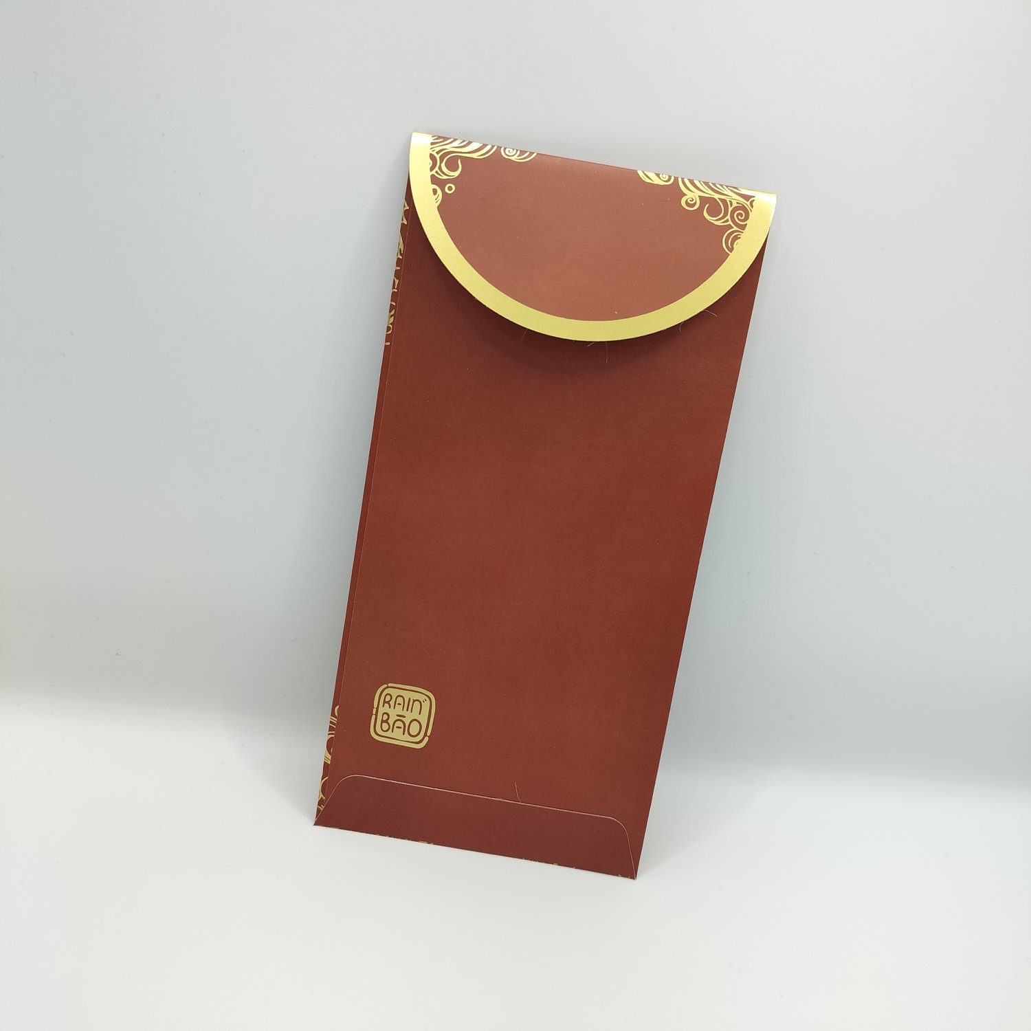 The back of a red envelope with gold dragon design