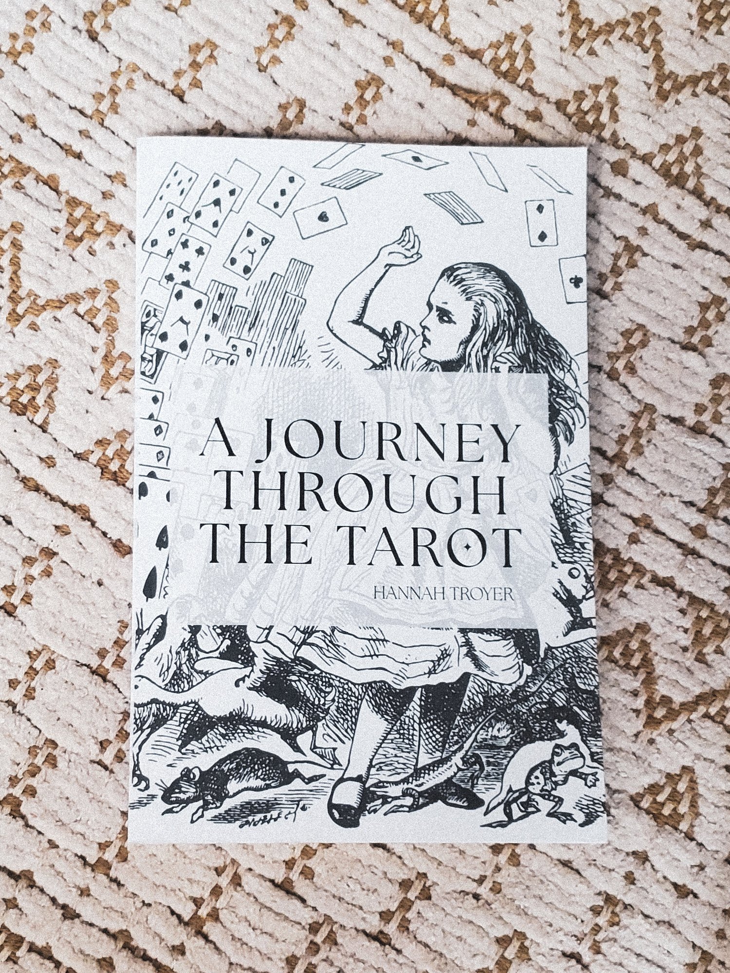 A journey through the tarot paperback on a rug