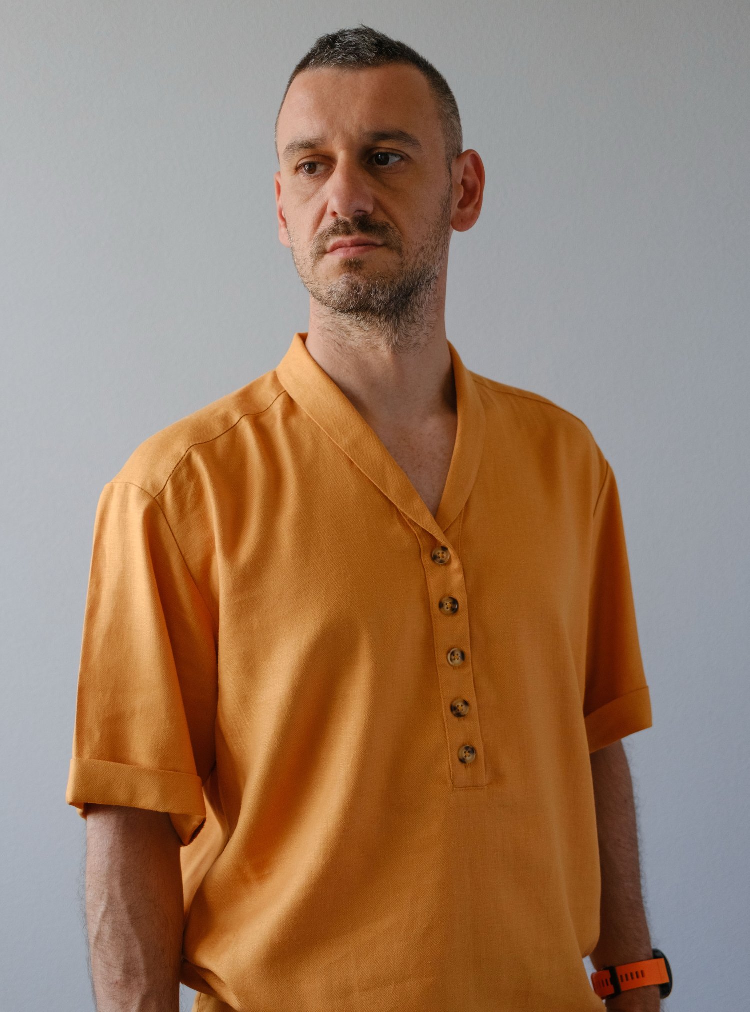 Mens linen henley shirt angled view button placket detail Jacomo pattern
