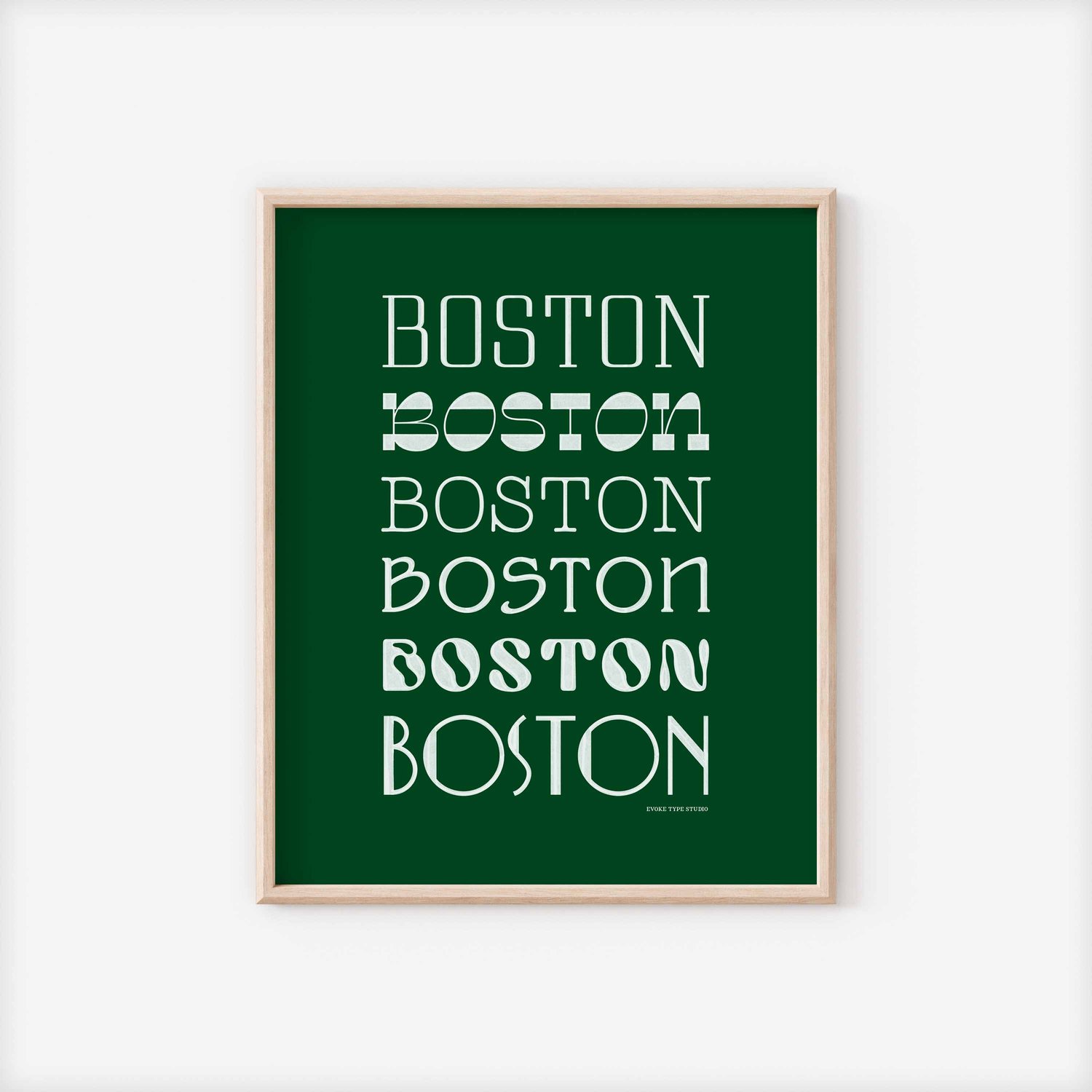 A framed picture of the word "Boston" drawn in various lettering styles. Artwork has a green and white color scheme
