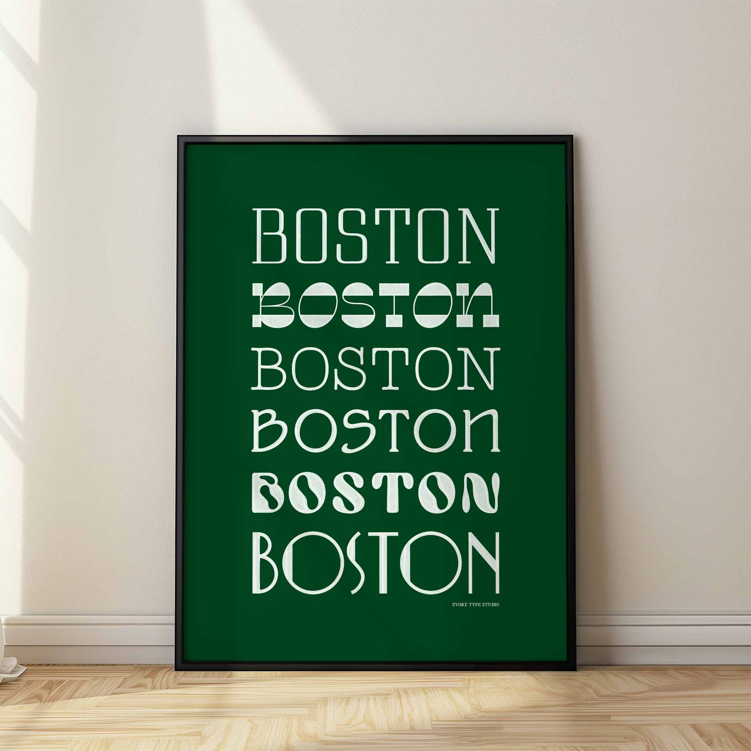 A framed picture of the word "Boston" drawn in various lettering styles. Artwork has a green and white color scheme