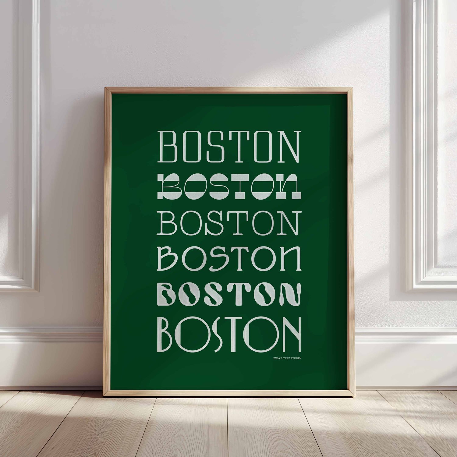 A framed picture of the word "Boston" drawn in various lettering styles. Artwork has a green and white color scheme